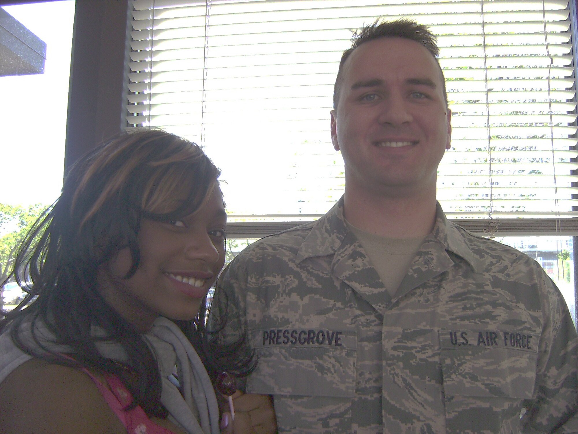 A1C William Pressgrove sang a beautiful rendition of "Bring Him Home" for the students during the rehersal.  He is pictured here with one of Cottage Hill's rising young singers.  