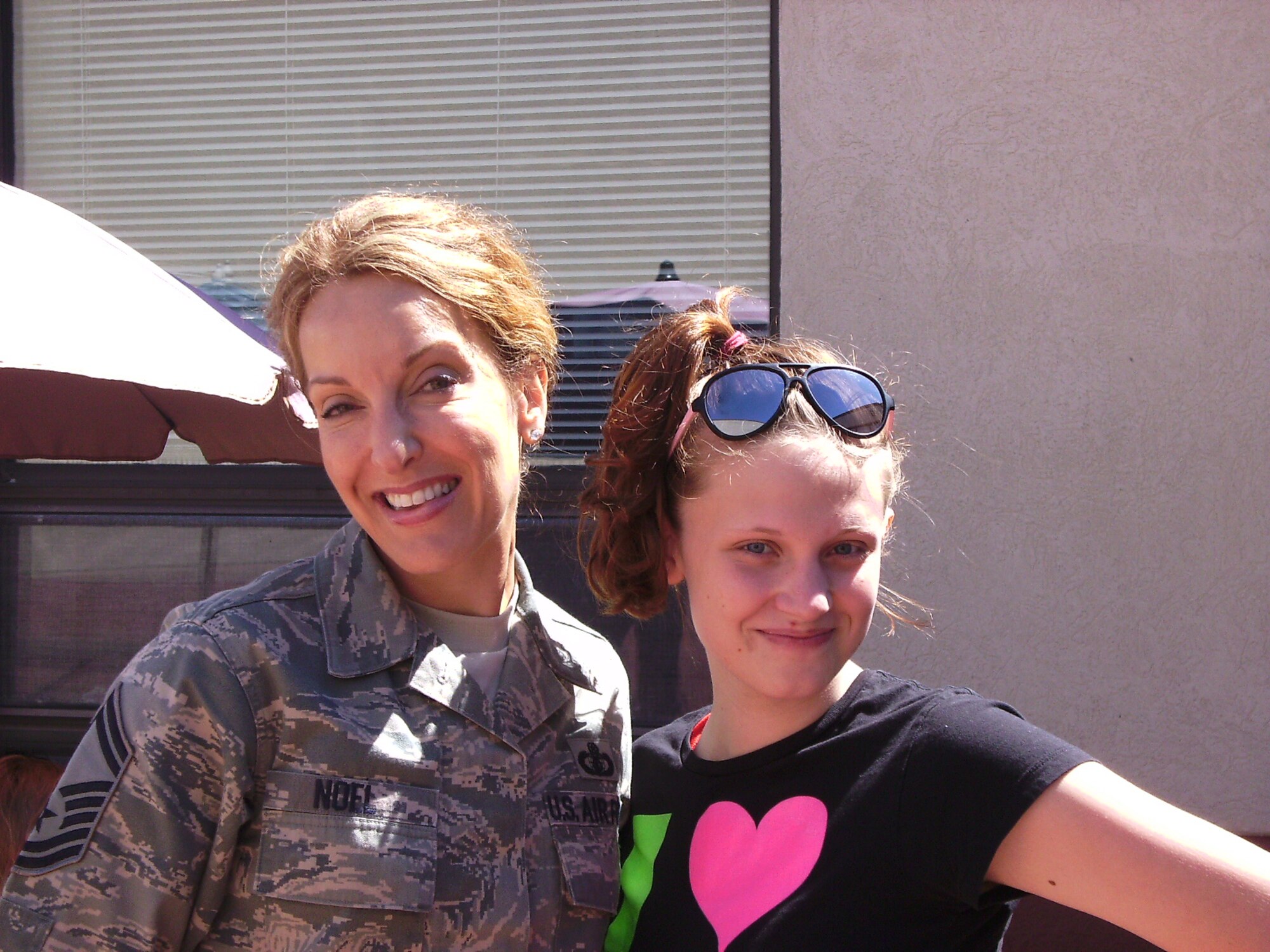 SMSgt Laura Noel, USAF Band of Liberty, enjoys lunch with the students from Cottage Hill Academy.