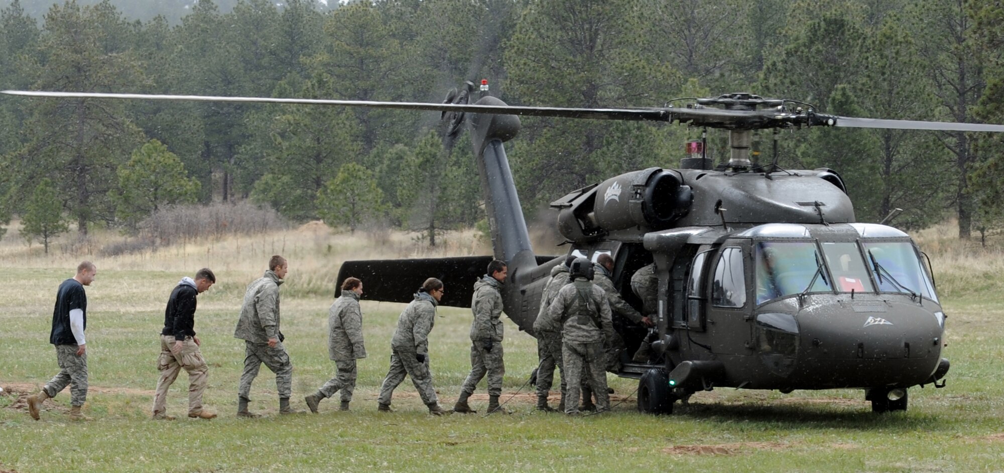 Cadet candidates file into a UH-60 Black Hawk helicopter during the Air Force Academy Preparatory School's 2010 Transition Exercise in Jacks Valley May 13, 2010. The transition exercise, or TX, tests cadet candidates' physical and military readiness. (U.S. Air Force photo/Johnny Wilson)