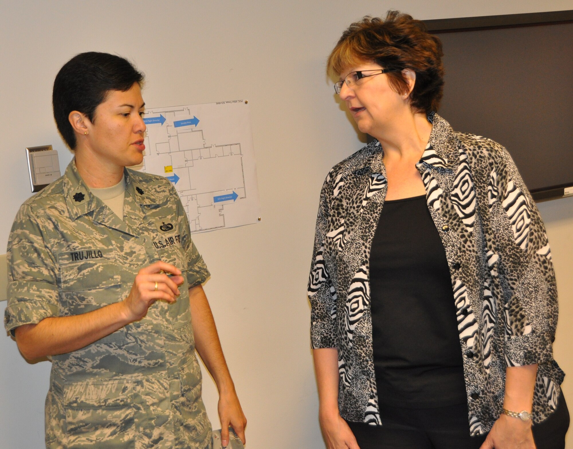 Lt. Col. Chlorinda Trujillo, 325th Communications Squadron commander, talks with Ms. Kassy Knouse, Defense Information Systems Agency CCRI co-team leader May 18.  (U.S. Air Force photo by Senior Airman Anthony J. Hyatt)