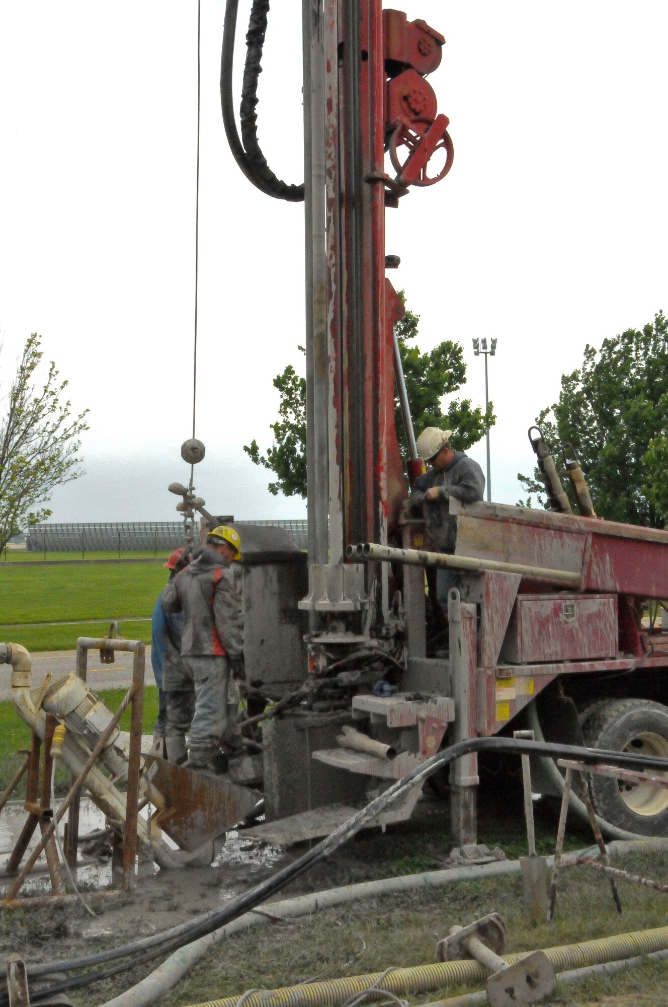 Contract workers with a company from the state of Illinois drill thermal wells into the ground at the 126th Air Refueling Wing on Scott AFB, Ill.  The Illinois National Guard Wing is expecting to see cost savings in heating and cooling expenses and become more energy efficient when the project is complete. (U.S. Air Force photo by Master Sergeant Franklin Hayes) (Released)