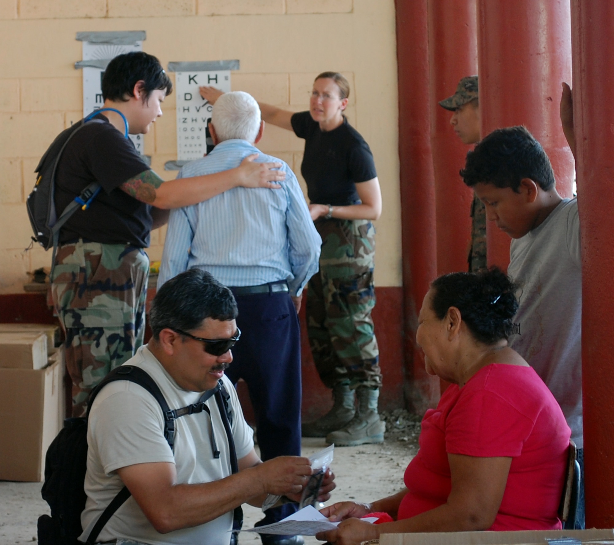 Members of the 173rd Medical Group examine multiple patients in Puerto Barrios, Guatemala during the Beyond Horizon's exercise April 12, 2010.  Twenty three personnel from the 173rd MDG deployed to Guatemala in support of this exercise which is designed to bring basic medical, dental and optical care to communities in need.   (U.S. Air Force Photo by Unknown)