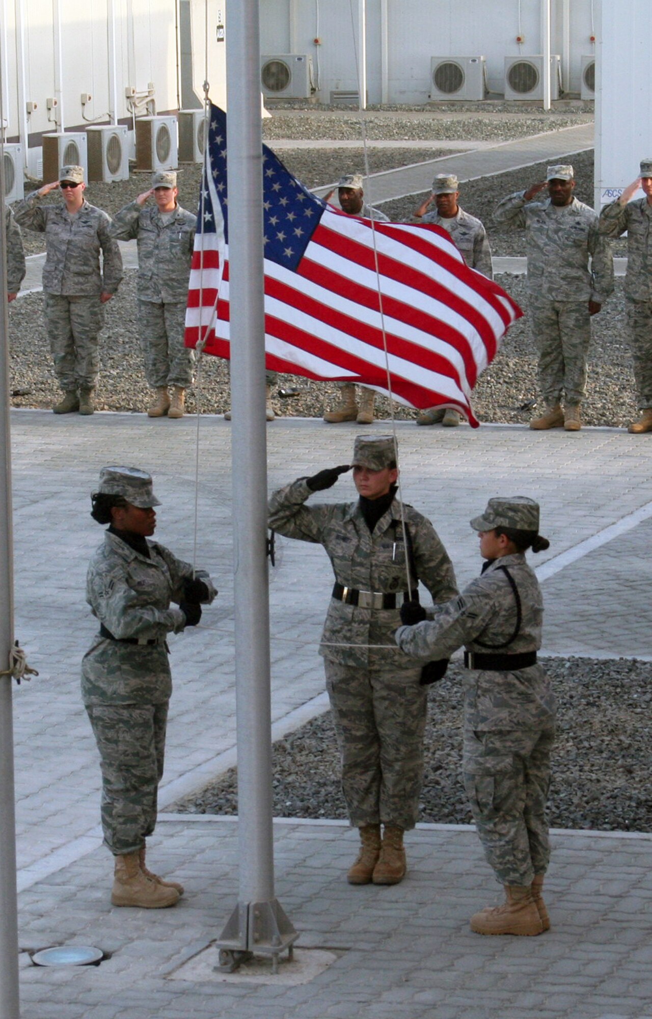 Airmen from the 380th Air Expeditionary Wing participate in a retreat ceremony April 30, 2010, at a non-disclosed base in Southwest Asia. Every Friday the 380th AEW holds a wing-wide retreat ceremony honoring the American flag. The 380th AEW supports operations Iraqi Freedom and Enduring Freedom and the Combined Joint Task Force-Horn of Africa. On April 30, the 380th Expeditionary Communications Squadron served as the lead unit for the retreat ceremony. (U.S. Air Force Photo/Master Sgt. Scott T. Sturkol/Released)