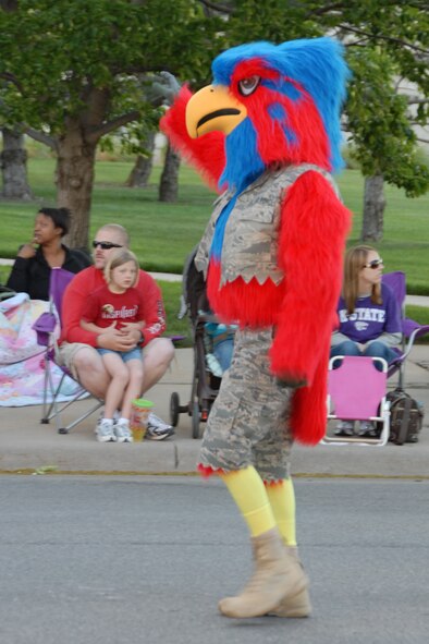 On May 7, 2010 Rock the Jayhawk waves to the crowd during the annual Wichita River Festival Sundown Parade.