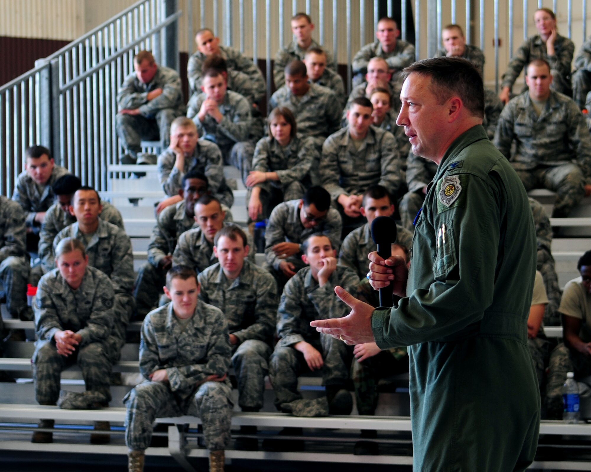 Col. Jon Norman, 355th Fighter Wing commander, speaks to the D-M Airmen about the importance of making responsible choices during a Safety Day briefing here May 17. The annual event, hosted by the wing safety office, is meant to highlight and warn Airmen of the hazards associated with the “101 Critical Days of Summer.” (U.S. Air Force photo/Airman Jerilyn Quintanilla)