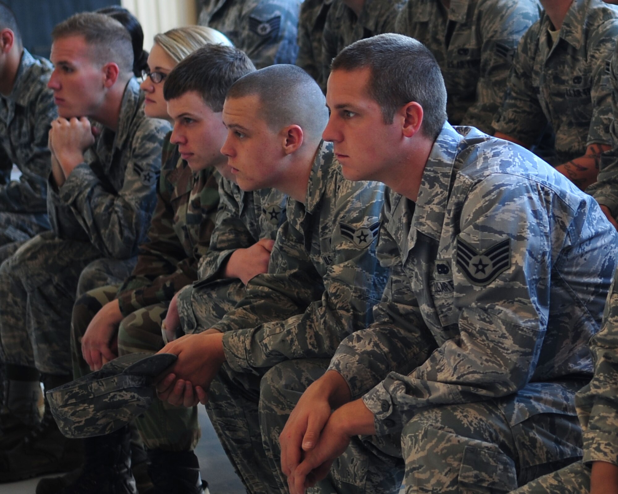Airmen attend a safety briefing May 17, as part of the base’s annual Safety Day event. Organized by the wing safety office, Safety Day promotes safe and responsible decisions among all Airmen during the critical days of summer. (U.S. Air Force photo/Airman Jerilyn Quintanilla)