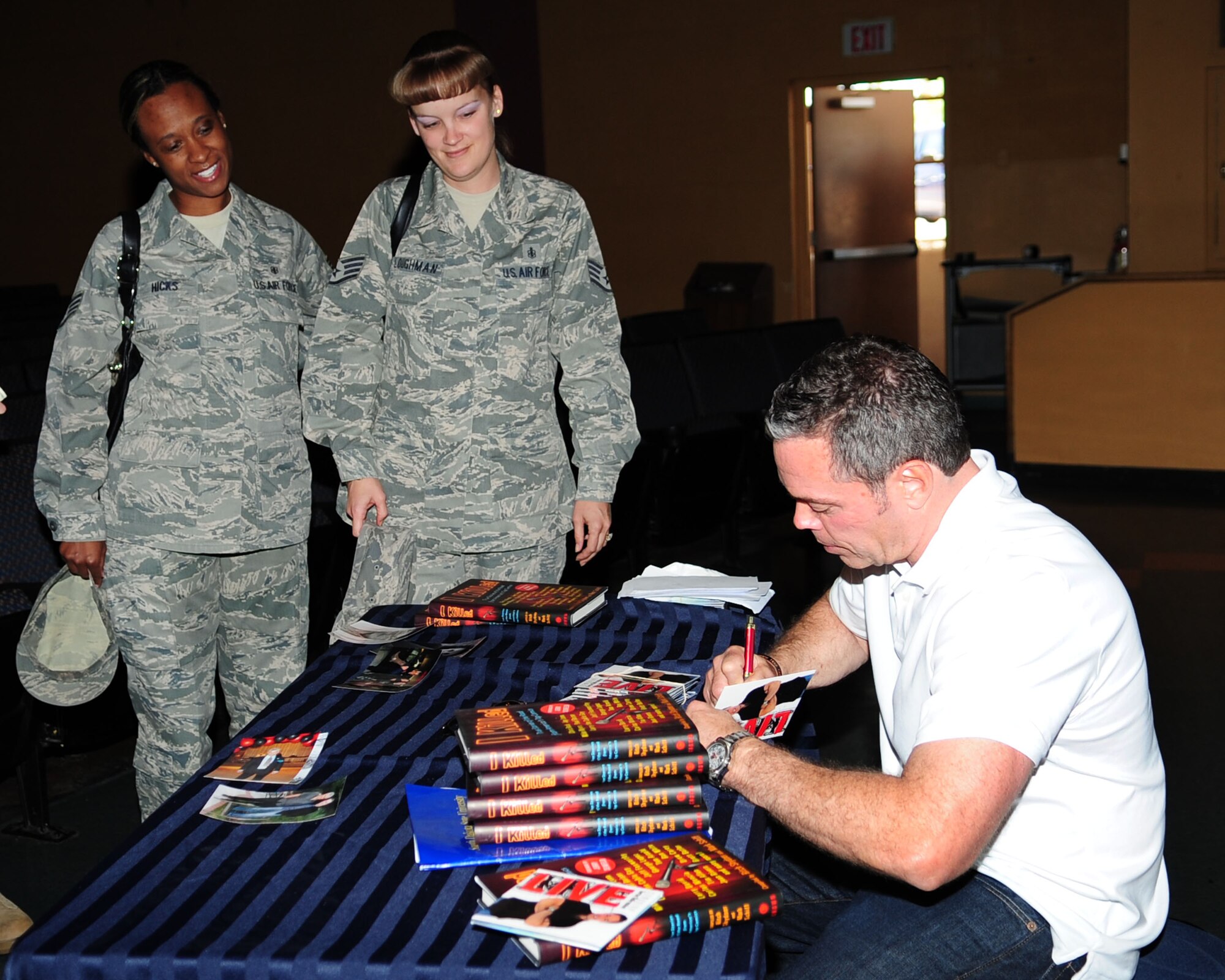 Comedian Bernie McGrenahan meets with Airmen after his performance at the base theater May 17. McGrenahan’s hour-long performance featured both stand-up comedy and an inspirational message about alcohol abuse. His visit was sponsored by the wing safety office, as part of the effort to promote safe and responsible decisions among all Airmen. (U.S. Air Force photo/Airman Jerilyn Quintanilla)