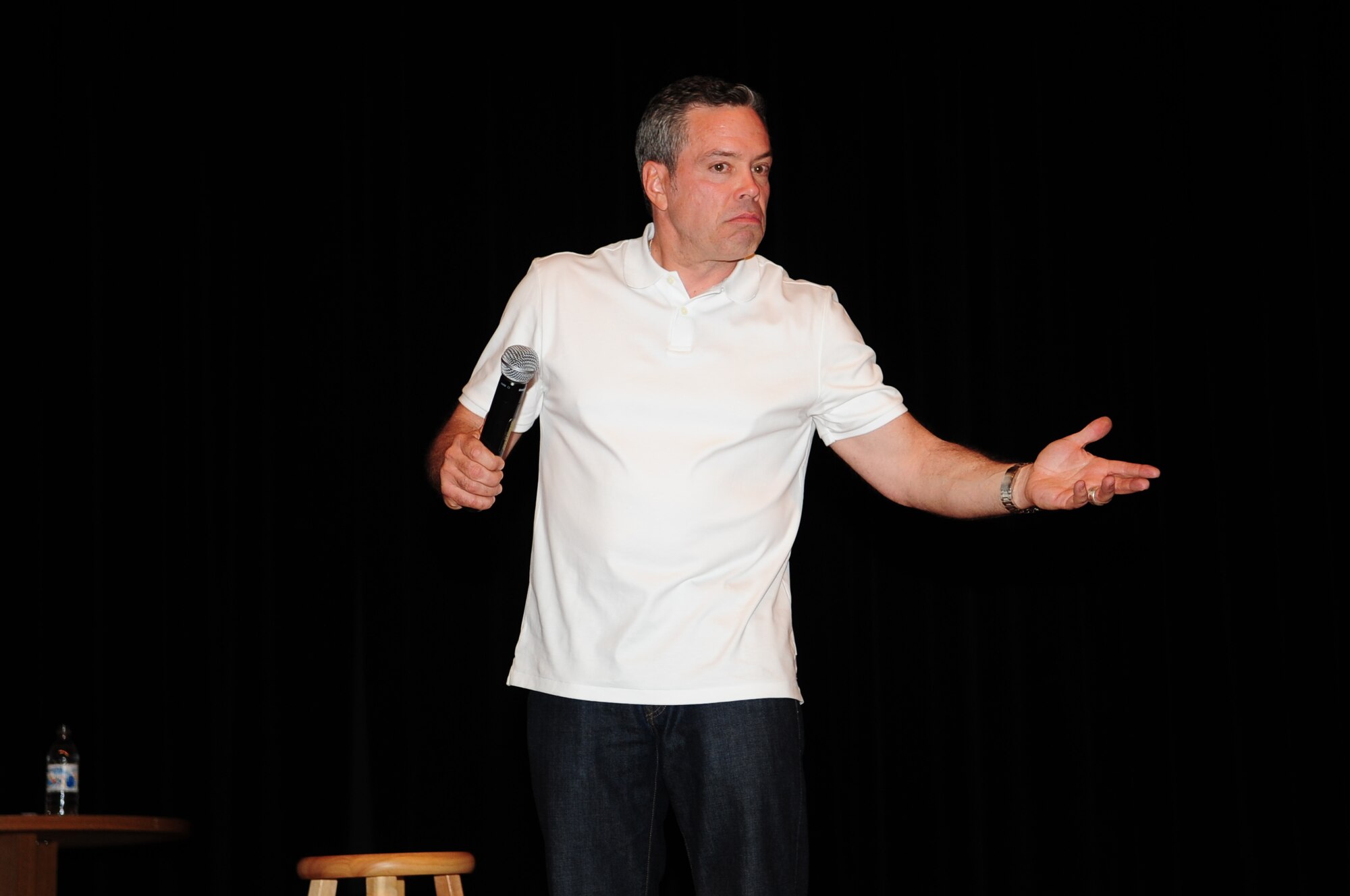 Comedian Bernie McGrenahan performs at the base theater May 17. McGrenahan’s hour-long performance featured both stand-up comedy and an inspirational message about alcohol abuse. His visit was sponsored by the wing safety office, as part of the effort to promote safe and responsible decisions among all Airmen. (U.S. Air Force photo/Airman Jerilyn Quintanilla)