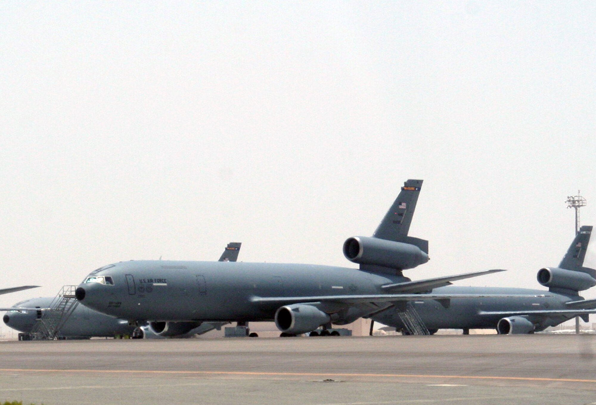 KC-10 Extender aircraft from the 908th Expeditionary Air Refueling Squadron are parked on the flightline for the 380th Air Expeditionary Wing at a non-disclosed base in Southwest Asia on May 19, 2010. According to the 380th AEW history office, In the first three months of 2010, Airmen supporting the KC-10 deployed air refueling mission in the U.S. Central Command area of responsibility helped the KC-10 fly more than 1,000 sorties offl-loading more than 108 million pounds of fuel to more than 6,600 aircraft in support of combat operations. KC-10s and the Airmen who support them are deployed from the 305th Air Mobility Wing at Joint Base McGuire-Dix-Lakehurst, N.J., and the 60th Air Mobility Wing at Travis Air Force Base, Calif. (U.S. Air Force Photo/Master Sgt. Scott T. Sturkol/Released)