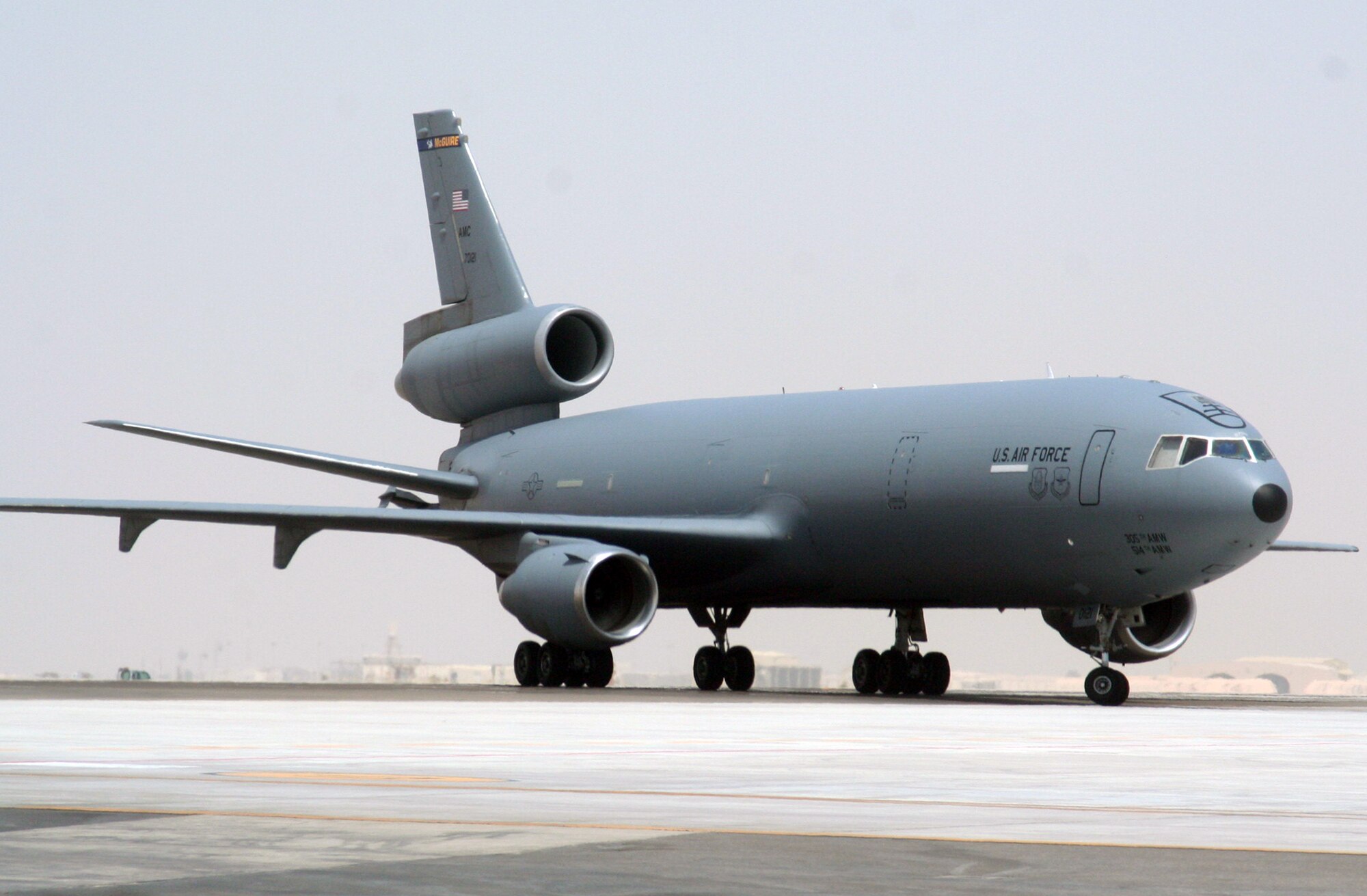 An aircrew from the 908th Expeditionary Air Refueling Squadron steers a KC-10 Extender down the taxiway of the flightline for the 380th Air Expeditionary Wing at a non-disclosed base in Southwest Asia on May 19, 2010. According to the 380th AEW history office, In the first three months of 2010, Airmen supporting the KC-10 deployed air refueling mission in the U.S. Central Command area of responsibility helped the KC-10 fly more than 1,000 sorties offl-loading more than 108 million pounds of fuel to more than 6,600 aircraft in support of combat operations. KC-10s and the Airmen who support them are deployed from the 305th Air Mobility Wing at Joint Base McGuire-Dix-Lakehurst, N.J., and the 60th Air Mobility Wing at Travis Air Force Base, Calif. (U.S. Air Force Photo/Master Sgt. Scott T. Sturkol/Released)
