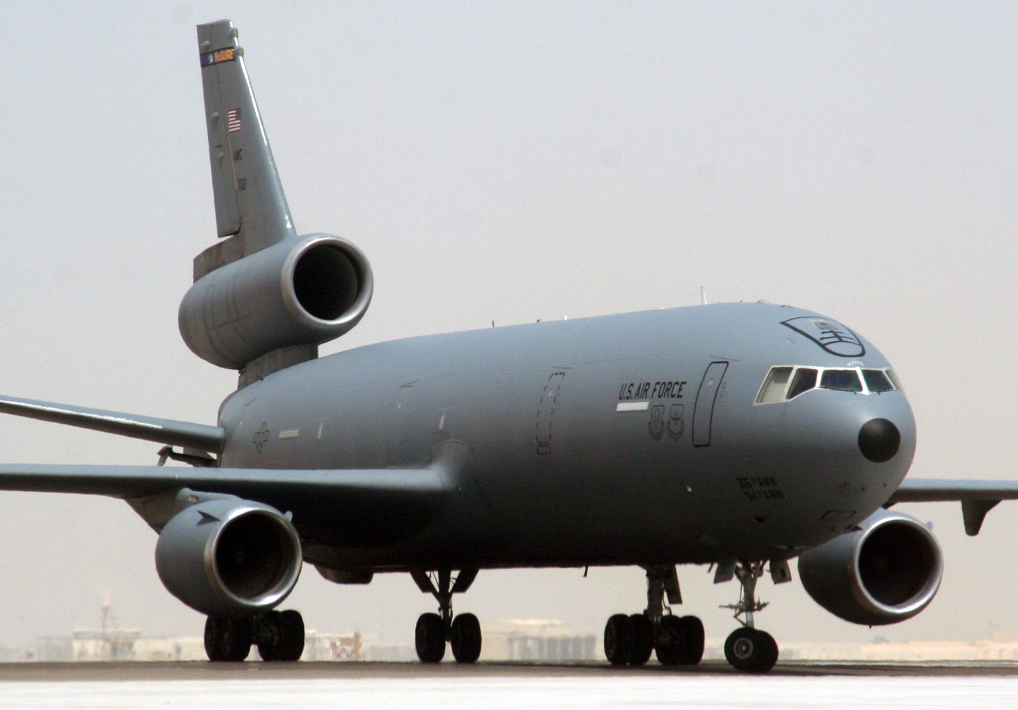 An aircrew from the 908th Expeditionary Air Refueling Squadron steers a KC-10 Extender down the taxiway of the flightline for the 380th Air Expeditionary Wing at a non-disclosed base in Southwest Asia on May 19, 2010. According to the 380th AEW history office, In the first three months of 2010, Airmen supporting the KC-10 deployed air refueling mission in the U.S. Central Command area of responsibility helped the KC-10 fly more than 1,000 sorties offl-loading more than 108 million pounds of fuel to more than 6,600 aircraft in support of combat operations. KC-10s and the Airmen who support them are deployed from the 305th Air Mobility Wing at Joint Base McGuire-Dix-Lakehurst, N.J., and the 60th Air Mobility Wing at Travis Air Force Base, Calif. (U.S. Air Force Photo/Master Sgt. Scott T. Sturkol/Released)
