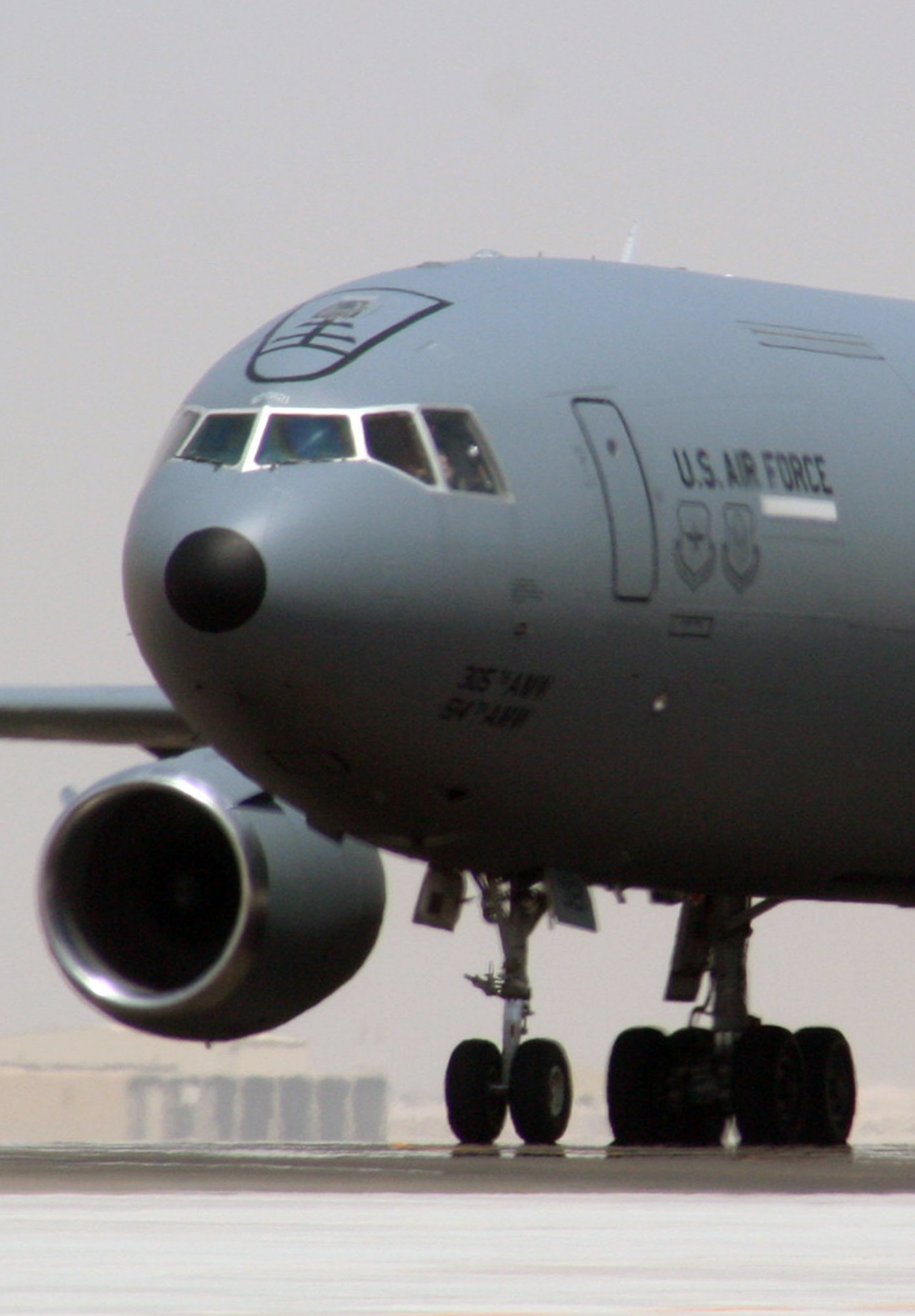 An aircrew from the 908th Expeditionary Air Refueling Squadron steers a KC-10 Extender down the taxiway of the flightline for the 380th Air Expeditionary Wing at a non-disclosed base in Southwest Asia on May 19, 2010. According to the 380th AEW history office, In the first three months of 2010, Airmen supporting the KC-10 deployed air refueling mission in the U.S. Central Command area of responsibility helped the KC-10 fly more than 1,000 sorties offl-loading more than 108 million pounds of fuel to more than 6,600 aircraft in support of combat operations. KC-10s and the Airmen who support them are deployed from the 305th Air Mobility Wing at Joint Base McGuire-Dix-Lakehurst, N.J., and the 60th Air Mobility Wing at Travis Air Force Base, Calif. (U.S. Air Force Photo/Master Sgt. Scott T. Sturkol/Released)
