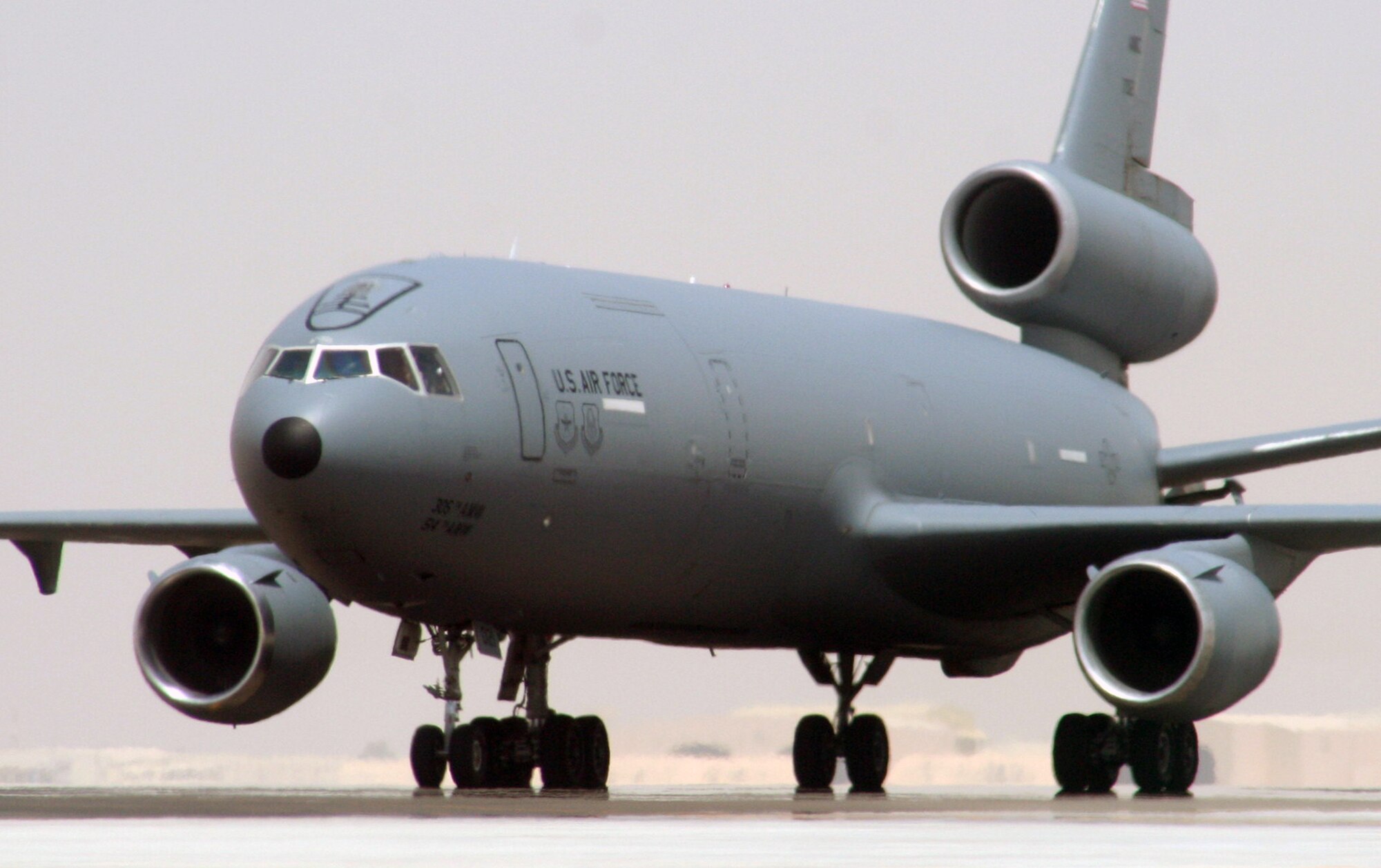 An aircrew from the 908th Expeditionary Air Refueling Squadron steers a KC-10 Extender down the taxiway of the flightline for the 380th Air Expeditionary Wing at a non-disclosed base in Southwest Asia on May 19, 2010. According to the 380th AEW history office, In the first three months of 2010, Airmen supporting the KC-10 deployed air refueling mission in the U.S. Central Command area of responsibility helped the KC-10 fly more than 1,000 sorties offl-loading more than 108 million pounds of fuel to more than 6,600 aircraft in support of combat operations. KC-10s and the Airmen who support them are deployed from the 305th Air Mobility Wing at Joint Base McGuire-Dix-Lakehurst, N.J., and the 60th Air Mobility Wing at Travis Air Force Base, Calif. (U.S. Air Force Photo/Master Sgt. Scott T. Sturkol/Released)
