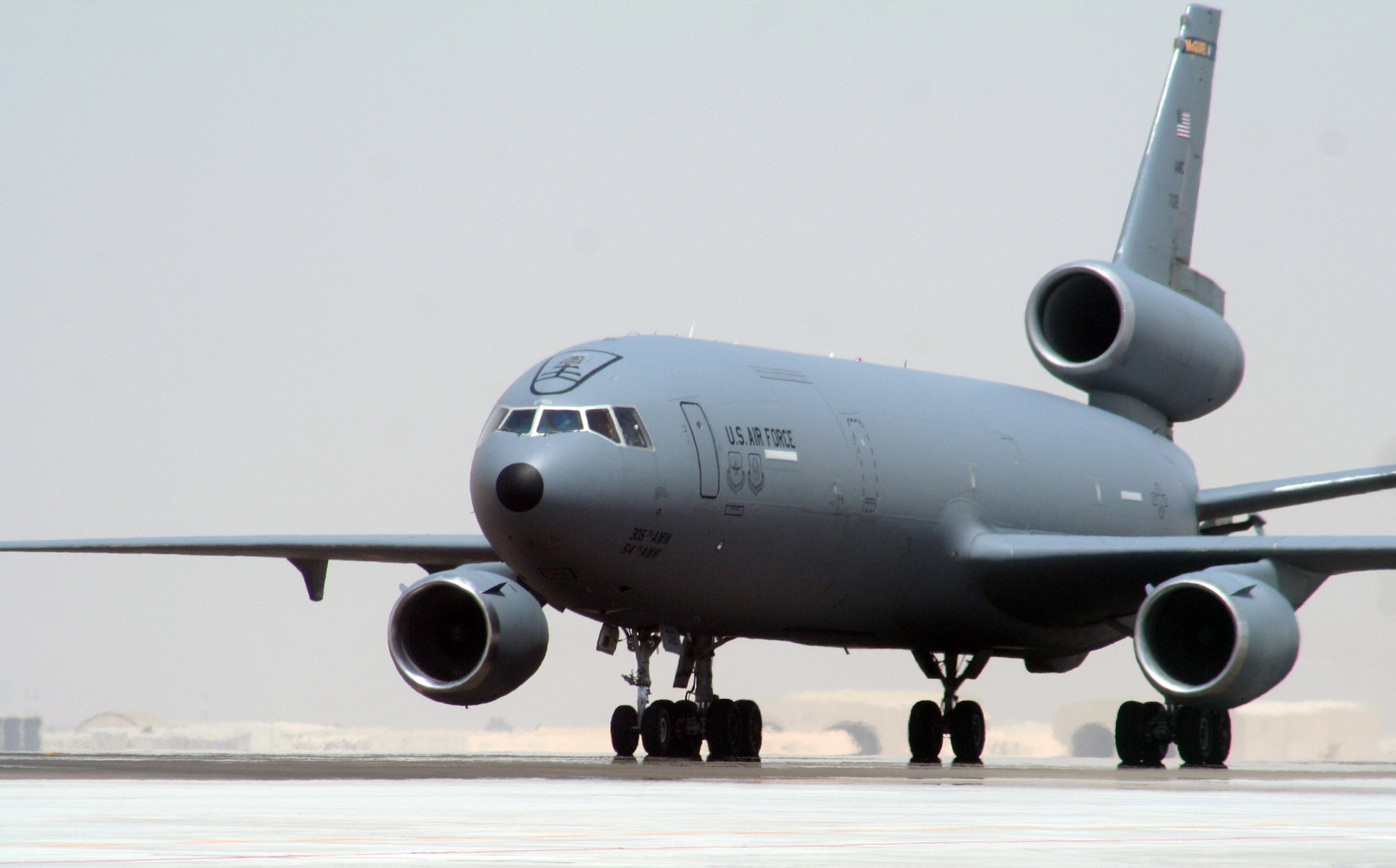 An aircrew from the 908th Expeditionary Air Refueling Squadron steers a KC-10 Extender down the taxiway of the flightline for the 380th Air Expeditionary Wing at a non-disclosed base in Southwest Asia on May 19, 2010. According to the 380th AEW history office, In the first three months of 2010, Airmen supporting the KC-10 deployed air refueling mission in the U.S. Central Command area of responsibility helped the KC-10 fly more than 1,000 sorties offl-loading more than 108 million pounds of fuel to more than 6,600 aircraft in support of combat operations. KC-10s and the Airmen who support them are deployed from the 305th Air Mobility Wing at Joint Base McGuire-Dix-Lakehurst, N.J., and the 60th Air Mobility Wing at Travis Air Force Base, Calif. (U.S. Air Force Photo/Master Sgt. Scott T. Sturkol/Released)
