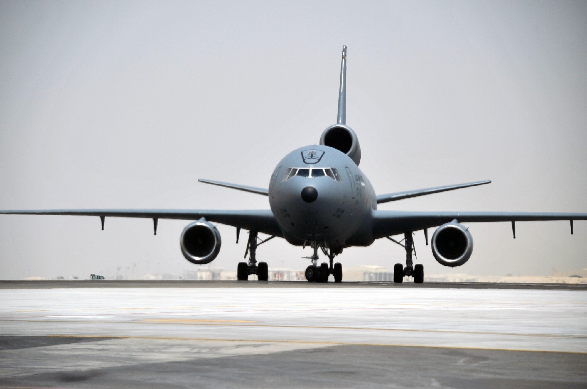 An aircrew from the 908th Expeditionary Air Refueling Squadron steers a KC-10 Extender down the taxiway of the flightline for the 380th Air Expeditionary Wing at a non-disclosed base in Southwest Asia on May 19, 2010. According to the 380th AEW history office, In the first three months of 2010, Airmen supporting the KC-10 deployed air refueling mission in the U.S. Central Command area of responsibility helped the KC-10 fly more than 1,000 sorties offl-loading more than 108 million pounds of fuel to more than 6,600 aircraft in support of combat operations. KC-10s and the Airmen who support them are deployed from the 305th Air Mobility Wing at Joint Base McGuire-Dix-Lakehurst, N.J., and the 60th Air Mobility Wing at Travis Air Force Base, Calif. (U.S. Air Force Photo/Master Sgt. Scott T. Sturkol/Released)
