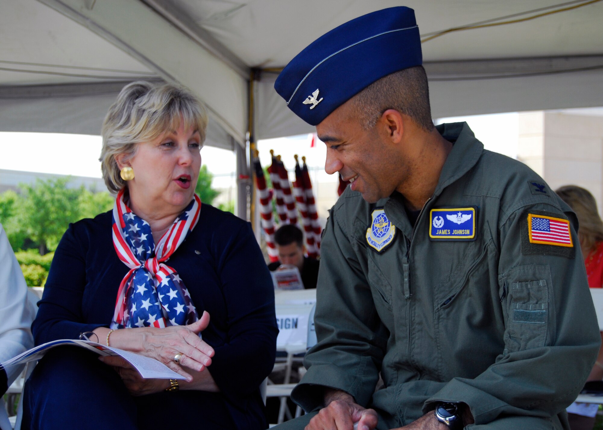 Col. James Johnson, 43rd Airlift Wing Commander, speaks with Mary Gray, founder and executive director of Operation Bandanas, at the Glory Days Field of Honor event at the Airborne Special Operations Museum, May 15. The Field of Honor recognizes service members who are currently serving, those who have served, and who have made the supreme sacrifice. (U.S. Air Force photo/2nd Lt. Cammie Quinn)