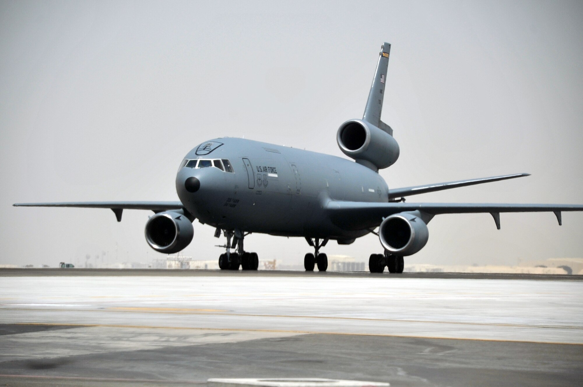An aircrew from the 908th Expeditionary Air Refueling Squadron steers a KC-10 Extender down the taxiway of the flightline for the 380th Air Expeditionary Wing at a non-disclosed base in Southwest Asia on May 19, 2010. According to the 380th AEW history office, In the first three months of 2010, Airmen supporting the KC-10 deployed air refueling mission in the U.S. Central Command area of responsibility helped the KC-10 fly more than 1,000 sorties offl-loading more than 108 million pounds of fuel to more than 6,600 aircraft in support of combat operations. KC-10s and the Airmen who support them are deployed from the 305th Air Mobility Wing at Joint Base McGuire-Dix-Lakehurst, N.J., and the 60th Air Mobility Wing at Travis Air Force Base, Calif. (U.S. Air Force Photo/Master Sgt. Scott T. Sturkol/Released)
