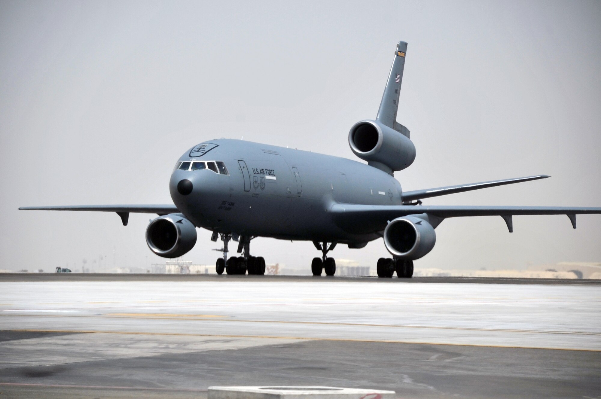 An aircrew from the 908th Expeditionary Air Refueling Squadron steers a KC-10 Extender down the taxiway of the flightline for the 380th Air Expeditionary Wing at a non-disclosed base in Southwest Asia on May 19, 2010. According to the 380th AEW history office, In the first three months of 2010, Airmen supporting the KC-10 deployed air refueling mission in the U.S. Central Command area of responsibility helped the KC-10 fly more than 1,000 sorties offl-loading more than 108 million pounds of fuel to more than 6,600 aircraft in support of combat operations. KC-10s and the Airmen who support them are deployed from the 305th Air Mobility Wing at Joint Base McGuire-Dix-Lakehurst, N.J., and the 60th Air Mobility Wing at Travis Air Force Base, Calif. (U.S. Air Force Photo/Master Sgt. Scott T. Sturkol/Released)
