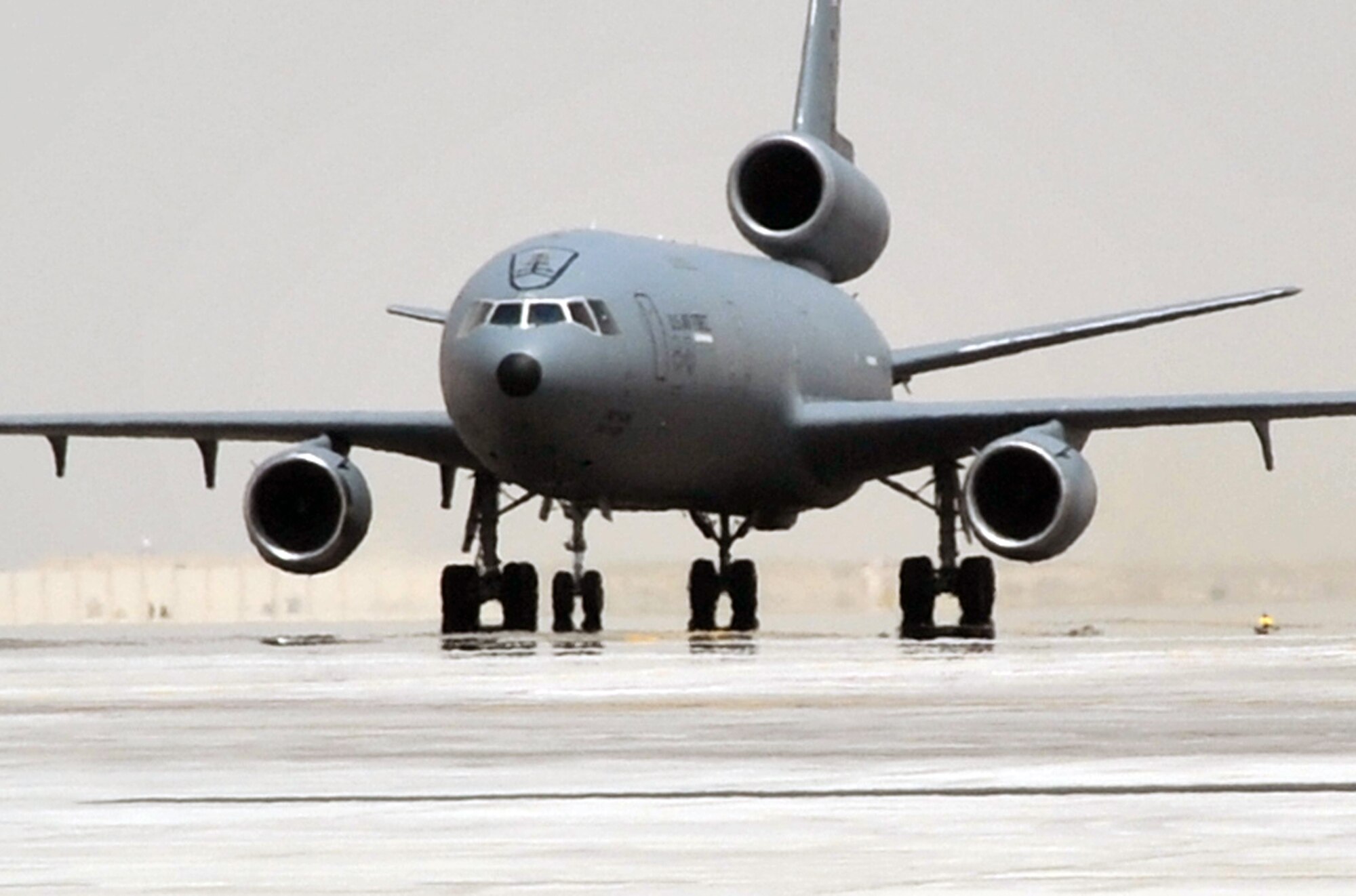 An aircrew from the 908th Expeditionary Air Refueling Squadron steers a KC-10 Extender down the taxiway of the flightline for the 380th Air Expeditionary Wing at a non-disclosed base in Southwest Asia on May 19, 2010. According to the 380th AEW history office, In the first three months of 2010, Airmen supporting the KC-10 deployed air refueling mission in the U.S. Central Command area of responsibility helped the KC-10 fly more than 1,000 sorties offl-loading more than 108 million pounds of fuel to more than 6,600 aircraft in support of combat operations. KC-10s and the Airmen who support them are deployed from the 305th Air Mobility Wing at Joint Base McGuire-Dix-Lakehurst, N.J., and the 60th Air Mobility Wing at Travis Air Force Base, Calif. (U.S. Air Force Photo/Master Sgt. Scott T. Sturkol/Released)
