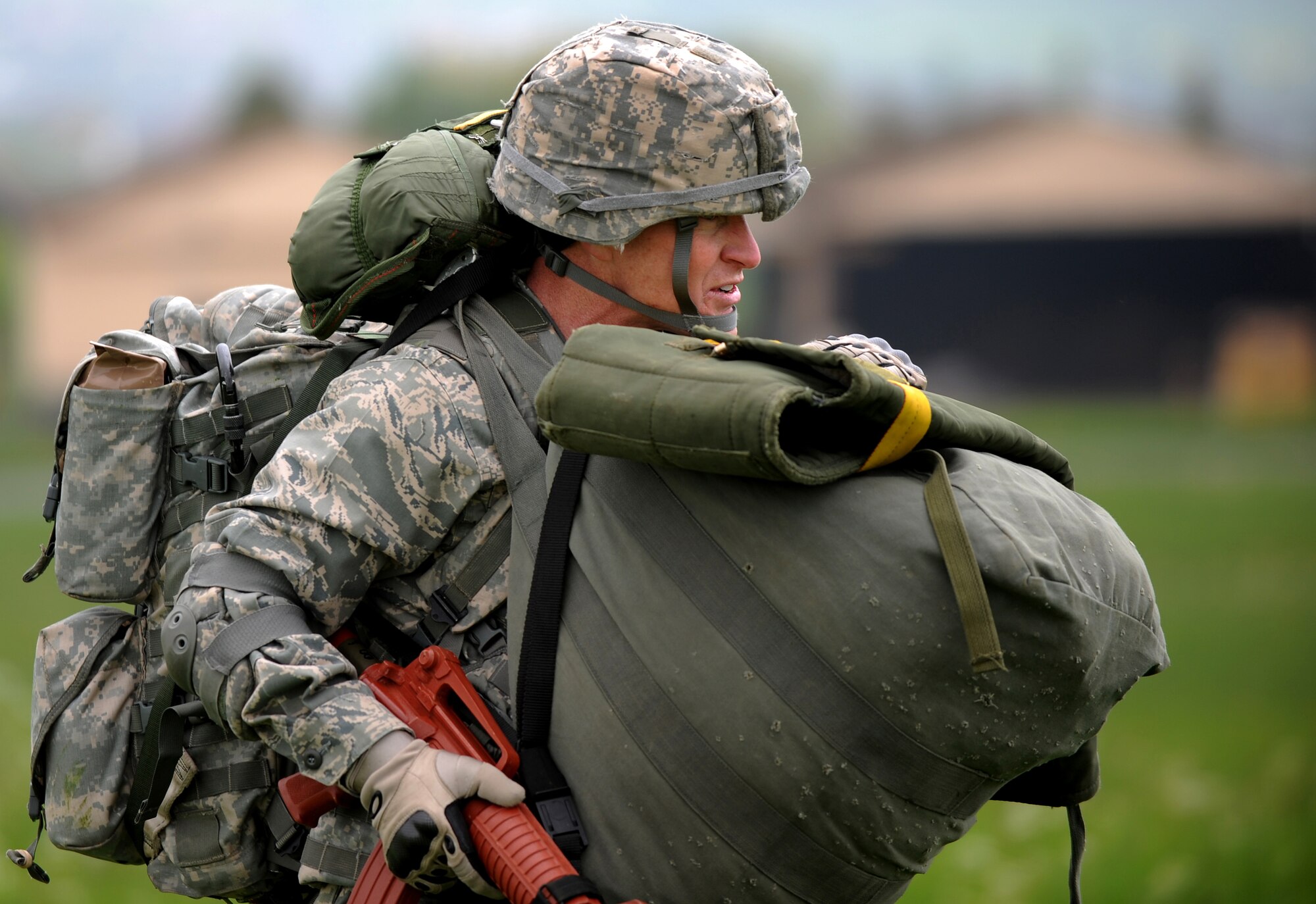 U.S. Air Force Col. Timothy Brown, 435th Contingency Response Group commander, walks to a rally point after conducting an airborne jump during an Operational Readiness Exercise, Flugplatz Bitburg, Germany, May 17, 2010. This ORE is the third of five exercises held to prepare Airmen for the Operational Readiness Inspection. The exercise held in Bitburg consisted of over 100 personnel, spanning 30 Air Force Specialty Codes, and three wings. (U.S. Air Force photo by Airman 1st Class Grovert Fuentes-Contreras)