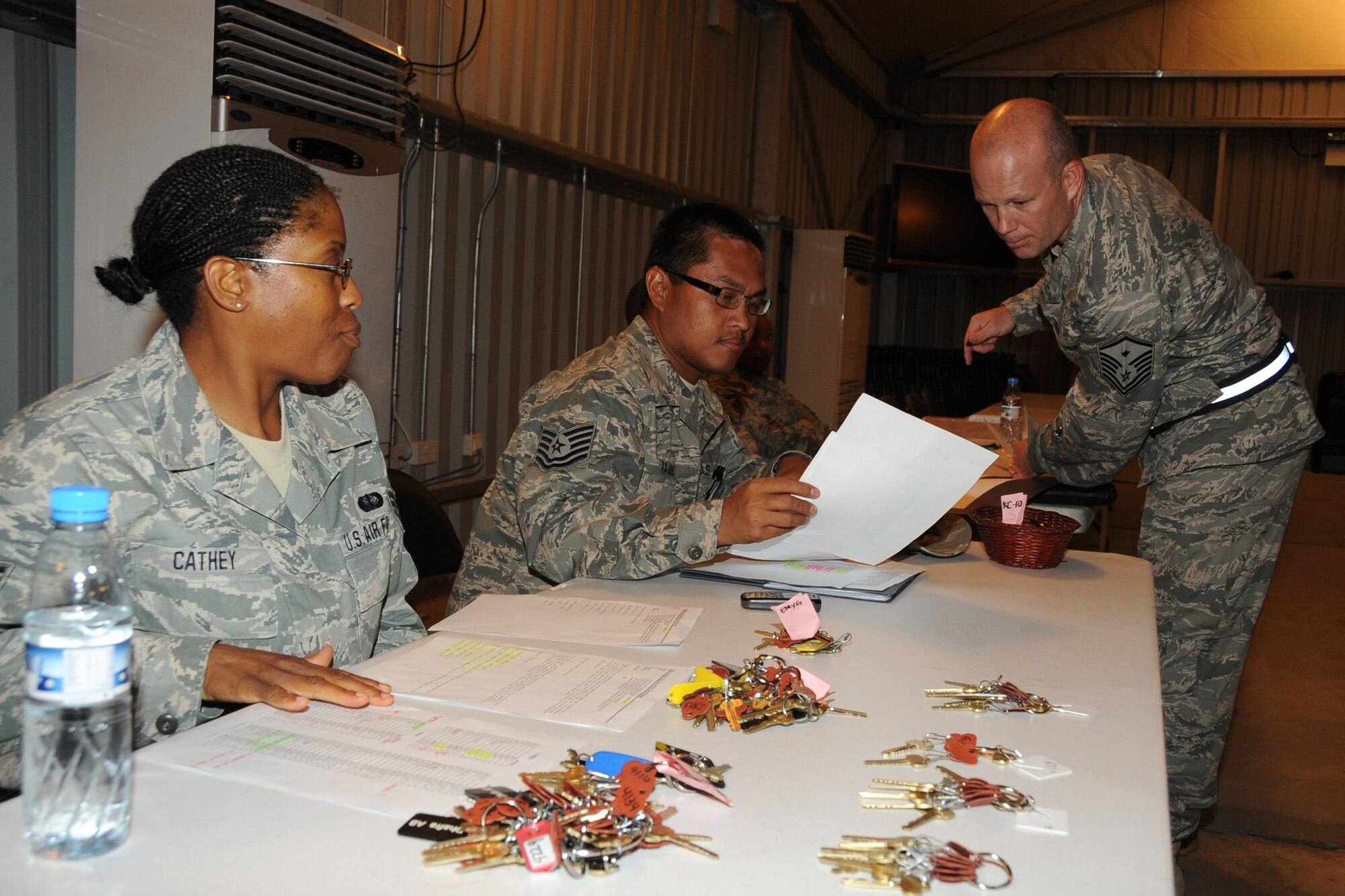 Master Sgt. Tony Rausch, 380th Expeditionary Operations Group first sergeant, does a final check on room assignments for incoming Airmen at an undisclosed location in Southwest Asia on May 8, 2010. The 380th AEW supports Operations Iraqi Freedom and Enduring Freedom and the Combined Joint Task Force-Horn of Africa. Its comprised of four groups and 12 squadrons.  The wing's deployed mission includes air refueling, surveillance and reconnaissance in support of overseas contingency operations in Southwest Asia.(U.S. Air Force photo/Senior Airman Jenifer H. Calhoun/Released)