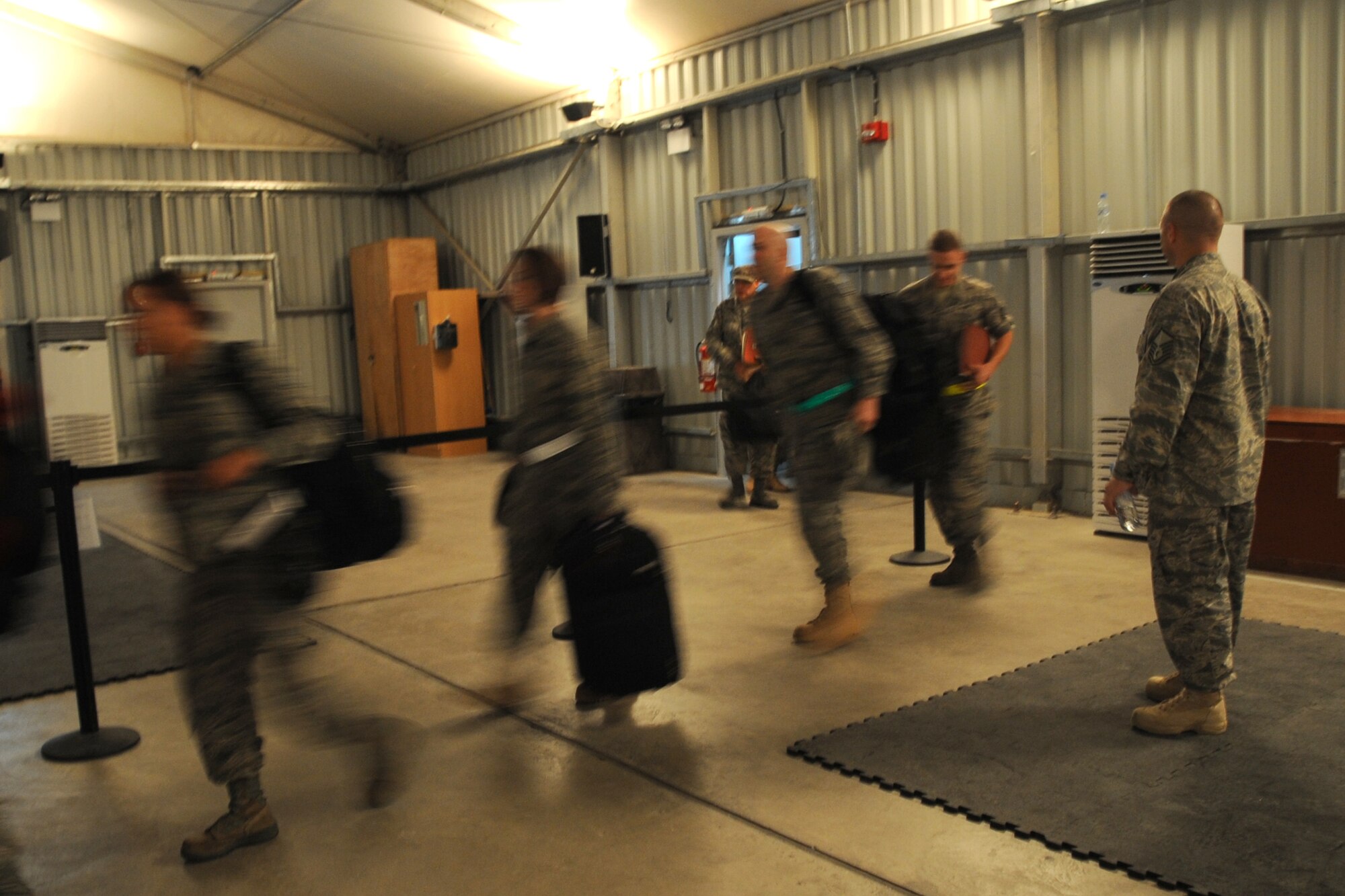 New Airmen of the 380th Air Expeditionary Wing in-process and attend briefings  at an undisclosed location in Southwest Asia on May 8, 2010.The 380th AEW supports Operations Iraqi Freedom and Enduring Freedom and the Combined Joint Task Force-Horn of Africa. Its comprised of four groups and 12 squadrons. The wing's deployed mission includes air refueling, surveillance and reconnaissance in support of overseas contingency operations in Southwest Asia.(U.S. Air Force photo/Senior Airman Jenifer H. Calhoun/Released)