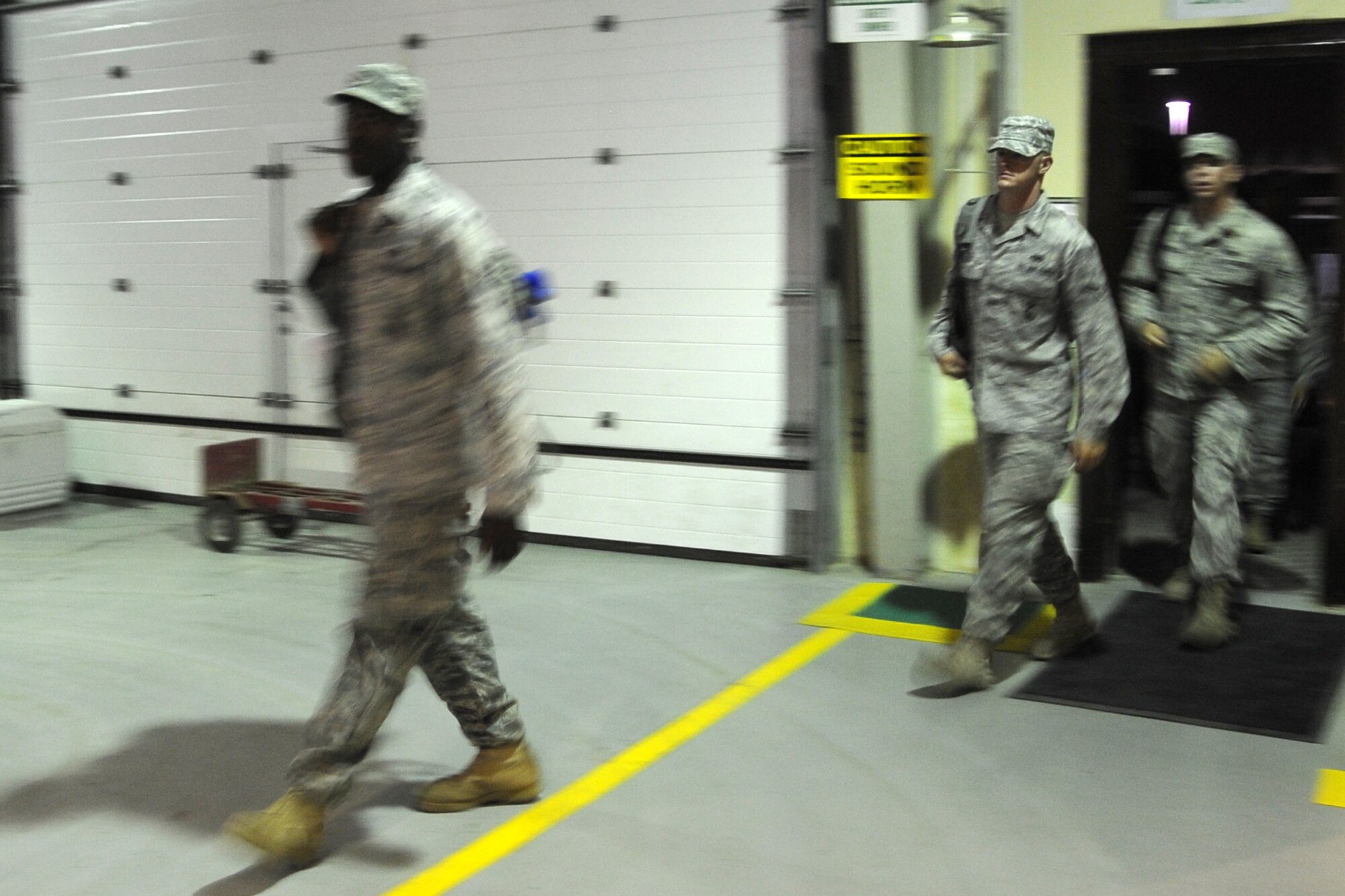 Members of the 380th Air Expeditionary Wing await departure from an undisclosed base in Southwest Asia, after completing their deployment here May 8, 2010. Due to the high numbers of incoming and out- going personnel, the 380th Expeditionary Logistics Readiness Squadron modified the vehicle maintenance shop into a temporary holding area for outgoing Airmen. The 380th AEW supports Operations Iraqi Freedom and Enduring Freedom and the Combined Joint Task Force-Horn of Africa. Its comprised of four groups and 12 squadrons.  The wing's deployed mission includes air refueling, surveillance and reconnaissance in support of overseas contingency operations in Southwest Asia.(U.S. Air Force photo/Senior Airman Jenifer H. Calhoun/Released)