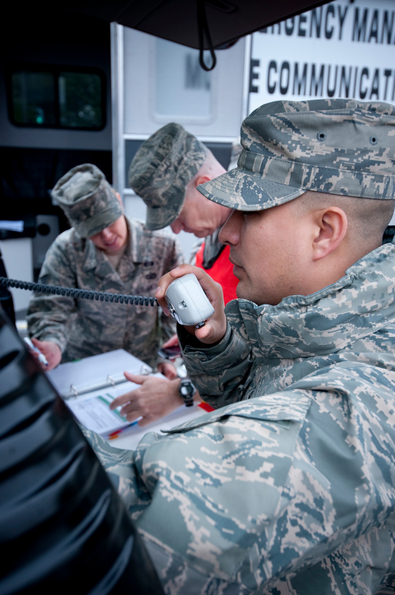 MISAWA AIR BASE, Japan -- Tech. Sgt. Tavio Soto, 35th Civil Engineer Squadron firefighter, makes a radio call during an emergency management exercise at the Richard Bong Theater May 19. The exercise tested Misawa Air Base's emergency responders' ability to respond to a terrorist event. (U.S. Air Force photo/Staff Sgt. Samuel Morse)