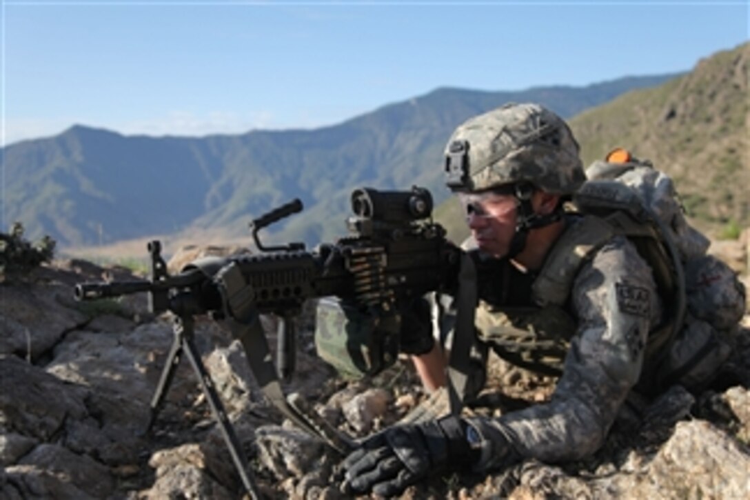 U.S. Army Pvt. John Torres, of Charlie Company, 2nd Battalion, 12th Infantry Regiment, Task Force Lethal Warrior, provides over watch security in Qatar Kala, Afghanistan, on May 6, 2010.  