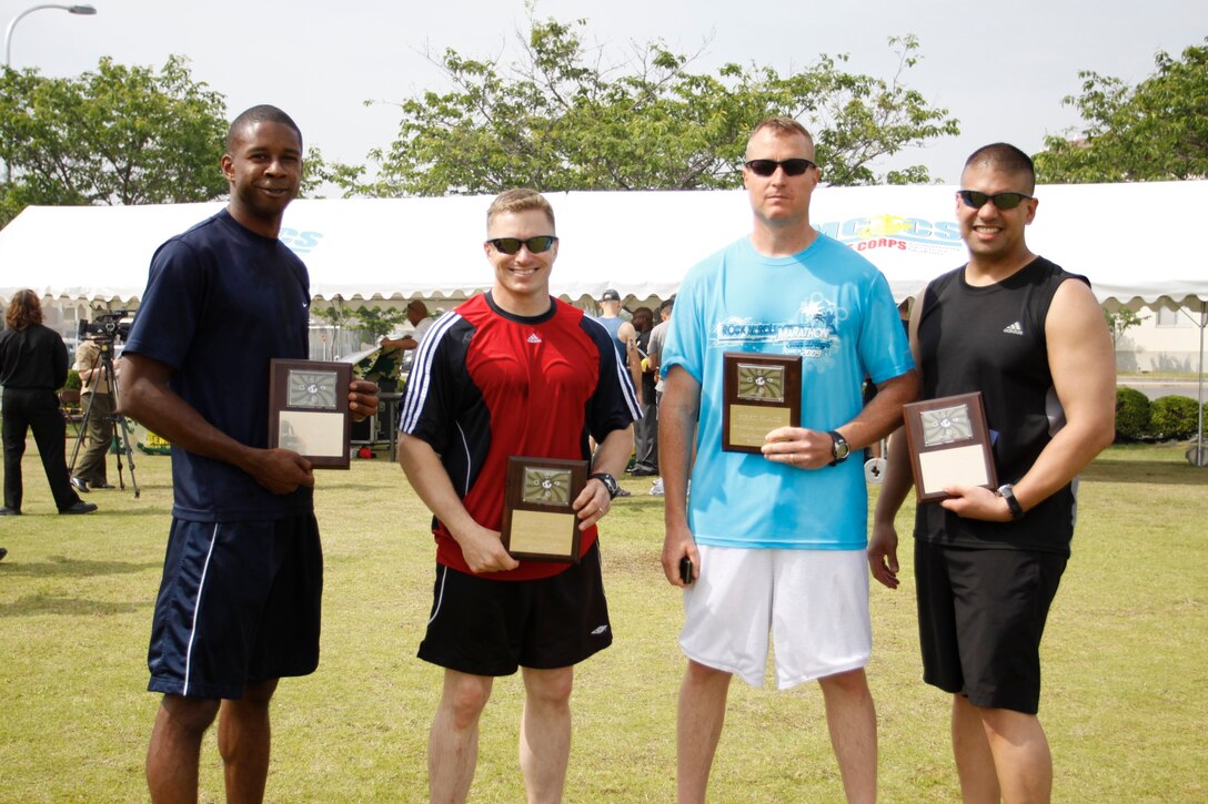 The Liberty Risk team, composed of Staff Sgt. Ajene M. Webley, utilities chief with Combat Logistics Company 36, Master Sgt. Jason L. Miller, supply chief with CLC-36, 1st Sgt. Michael J. Pritchard, CLC- 36 1st Sgt., and Maj. James S. Whiteker, commanding officer of CLC-36, takes home first place with an adjusted time of 47:29 during the Amazing Race here May 21.