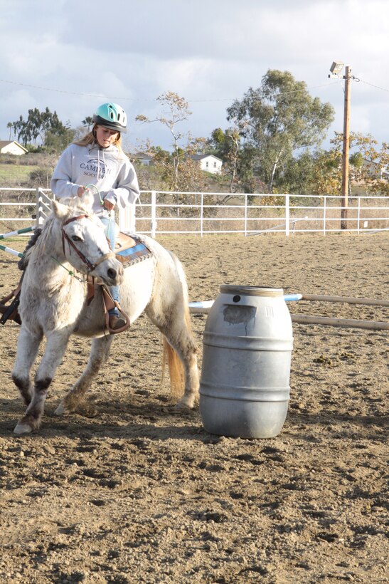 Lizzie Blais, a student at Stepp Stables, conducts a training session with her horse Thumper, at the facility here, Nov. 19. Stepp Stables offers affordable training that can be customized for the owner and horse's needs, from basic concepts to advanced show conditioning.