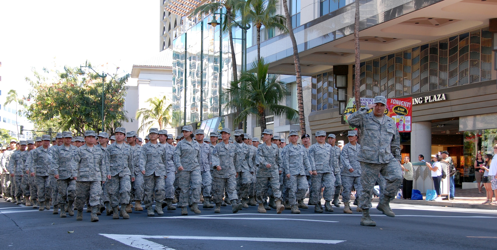 Col. Braden Sakai, 154th Wing vice commander, leads members of the Hawaii Air National Guard in executing "eyes right" as they go by the pass and review stand during the Salute to Troops parade held in Waikiki, Hawaii, May 22. The HIANG members were marching as part of the Military Appreciation Month celebration. Military Appreciation Month is designed to honor military members, past and present, and their families for their dedication, service and sacrifice to the nation.  (U.S. Air Force photo/Tech. Sgt. Betty J. Squatrito-Martin)