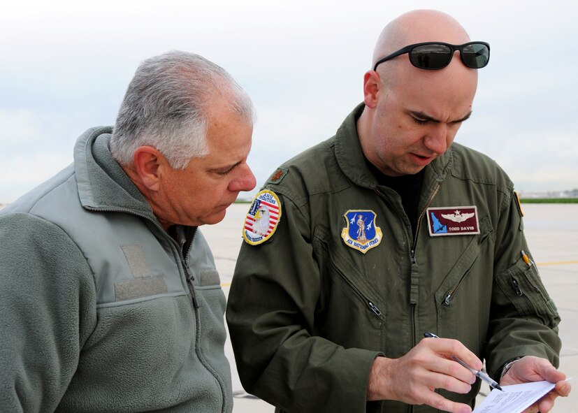 Chief Master Sgt. Ken Potter, 919th Maintenance Group, and Maj. Todd Davis, Virginia Air National Guard, talk over a maintenance report prior to a flight May 5 at Gowen Field, Idaho.  919th maintainers were sent to Boise, Idaho, to prepare four Talons to take off for one more mission – a flight into retirement and decommissioning.  Three of the Talons flew to Davis-Monthan Air Force Base, Ariz.  The other went to Hurlburt Field, Fla., to be placed in the Air Force Special Operations Command airpark.  (U.S. Air Force photo/Tech. Sgt. Samuel King Jr.) 