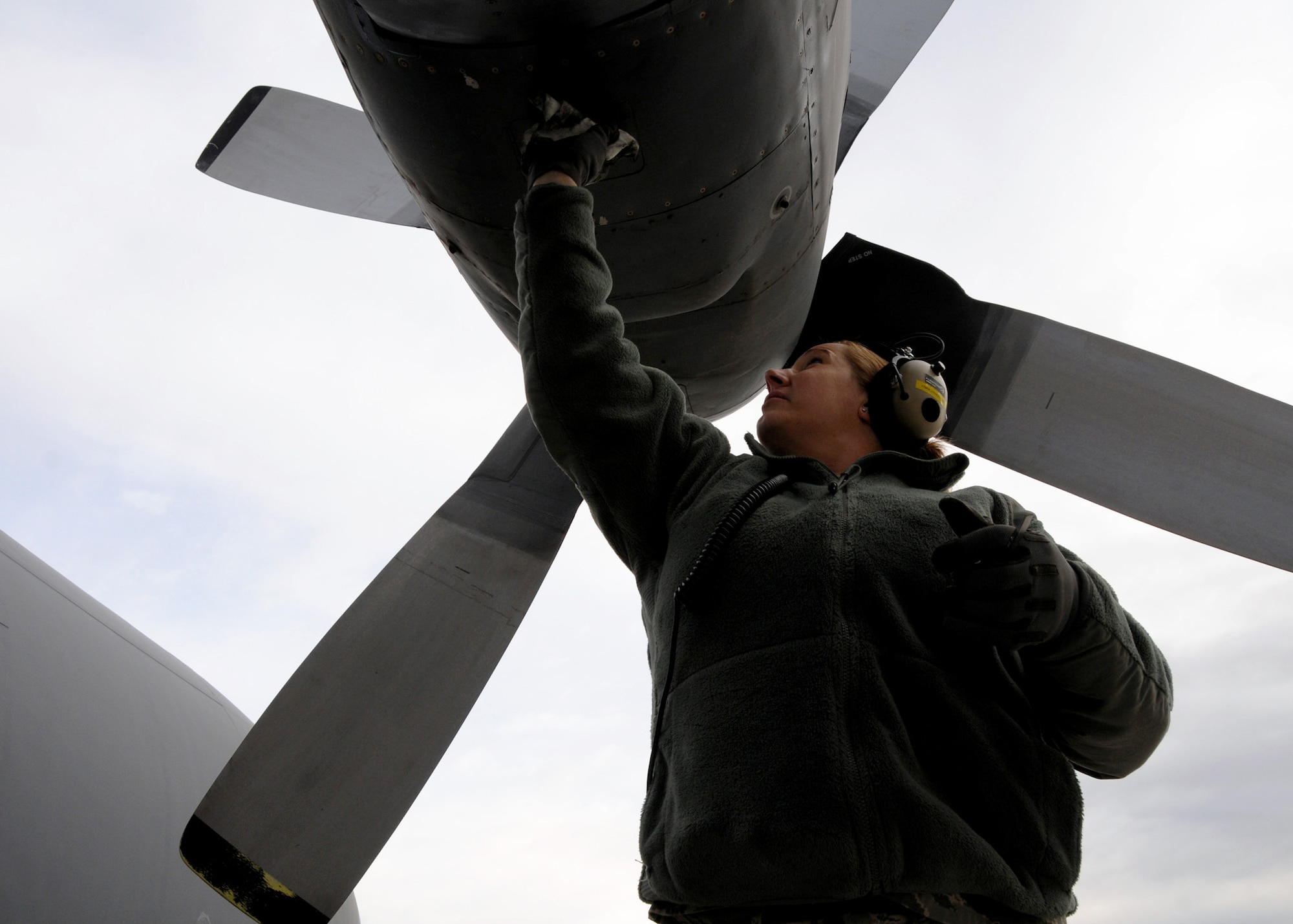 Staff Sgt. Jennifer Fender, 179th Maintenance Group, wipes off fluid from Engine 3 of MC-130E Combat Talon #555 prior to its final flight May 5 from Gowen Field, Idaho.  919th Special Operations Wing maintainers, along with the 179th were sent to Boise, Idaho, to prepare four Talons to take off for one more mission – a flight into retirement and decommissioning.  Three of the Talons flew to Davis-Monthan Air Force Base, Ariz.  The other went to Hurlburt Field, Fla., to be placed in the Air Force Special Operations Command airpark.  (U.S. Air Force photo/Tech. Sgt. Samuel King Jr.) 