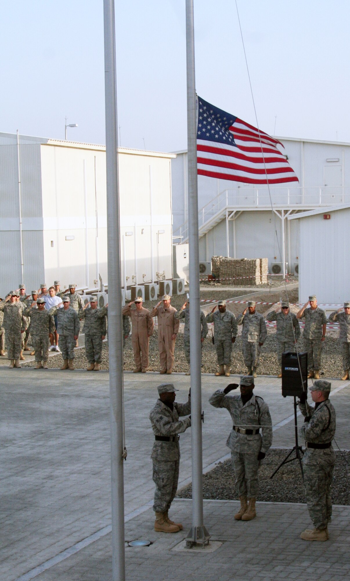Airmen from the 380th Air Expeditionary Wing participate in a retreat ceremony May 14, 2010, at a non-disclosed base in Southwest Asia. Every Friday the 380th AEW holds a wing-wide retreat ceremony honoring the American flag. The 380th AEW supports operations Iraqi Freedom and Enduring Freedom and the Combined Joint Task Force-Horn of Africa. On May 14, the 380th Expeditionary Medical Group served as the lead unit for the retreat ceremony. (U.S. Air Force Photo/Master Sgt. Scott T. Sturkol/Released)