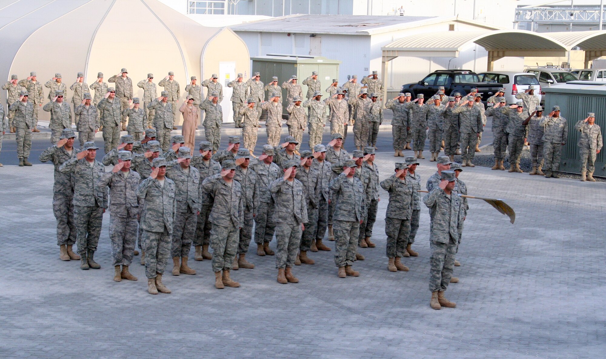Airmen from the 380th Air Expeditionary Wing participate in a retreat ceremony April 30, 2010, at a non-disclosed base in Southwest Asia. Every Friday the 380th AEW holds a wing-wide retreat ceremony honoring the American flag. The 380th AEW supports operations Iraqi Freedom and Enduring Freedom and the Combined Joint Task Force-Horn of Africa. On April 30, the 380th Expeditionary Communications Squadron served as the lead unit for the retreat ceremony. (U.S. Air Force Photo/Master Sgt. Scott T. Sturkol/Released)