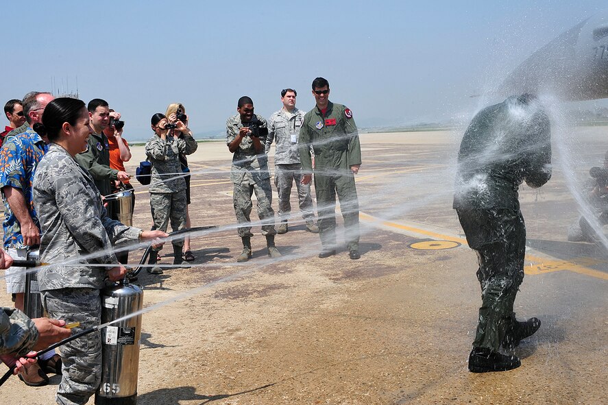 Col. Mark Mattison, 51st Fighter Wing vice commander, is hosed down during his "fini-flight" celebration at Osan Air Base, Republic of Korea, May 21. He has served as the wing's vice commander since June 2008. Colonel Mattison and his family are heading to Ramstein AB, Germany, where he will serve as Headquarters U.S. Air Forces in Europe director of staff. (U.S. Air Force photo/Staff Sgt. Eunique Stevens)