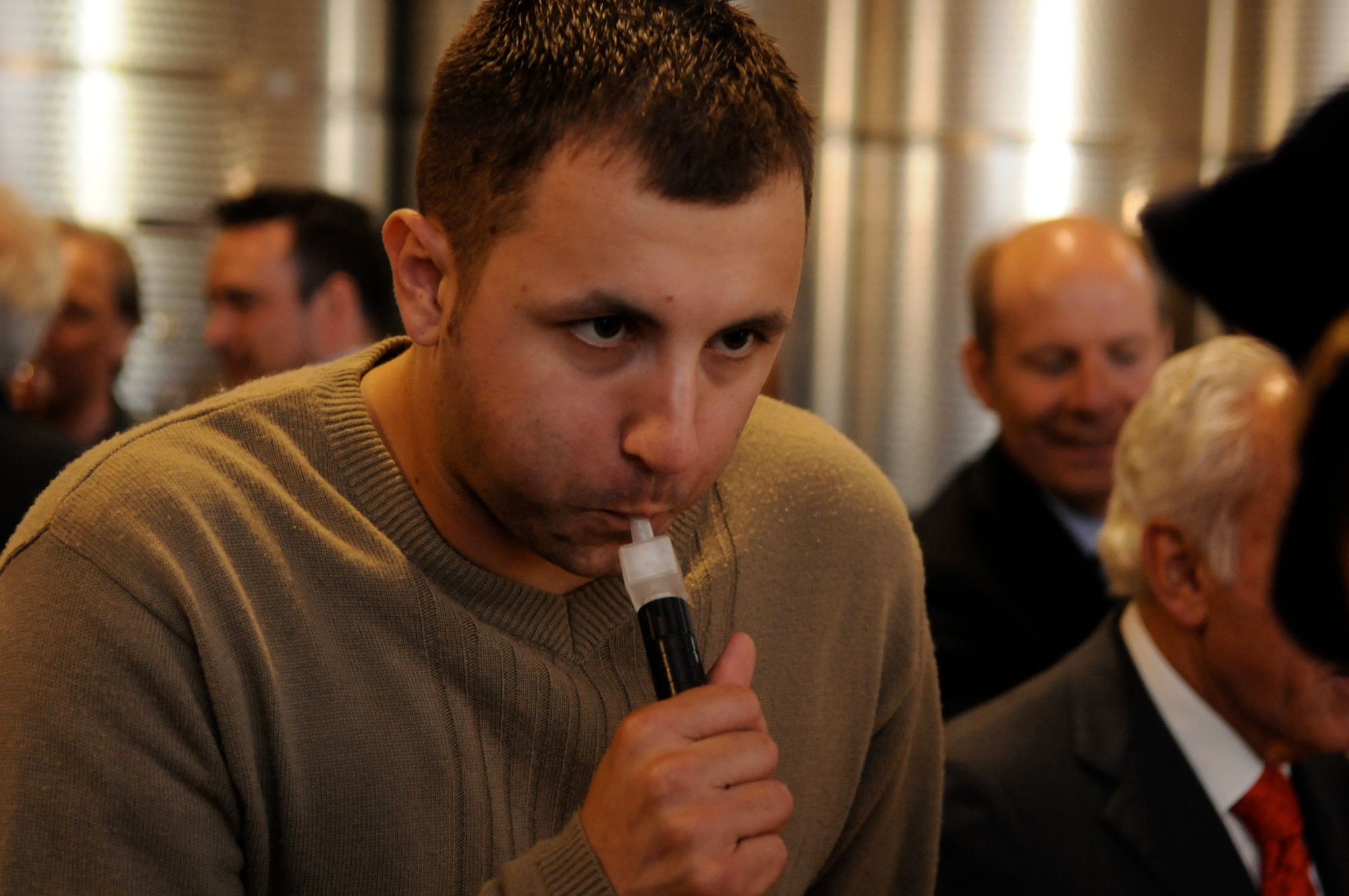 Airman 1st Class Ryan Even, 603rd Air Control Squadron, takes a breathalyzer test May 21 at the Gelisi vineyard. More than 30 young Airmen participated in an evening of free wine, food and round-trip transportation to an Italian vineyard to help them fully understand the affects alcohol can have on each individual. (U.S. Air Force photo/Staff Sgt. Justin Weaver)