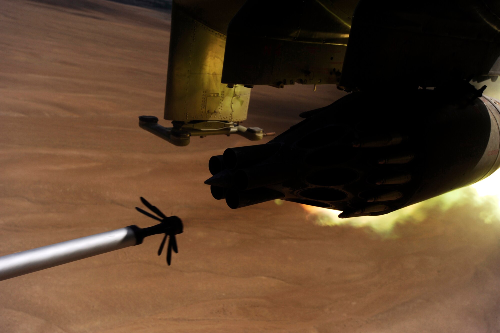 A KP long-guided rocket leaves its launcher mounted on an Afghan National Army Air Corps MI-35 helicopter May 11, 2010, on a live-fire training mission over Afghanistan.  Maj. Caleb Nimmo, Mi-35 team lead assigned to the 438th Air Expeditionary Advisor Squadron, and Hungarian Air Force Maj. Szili ''Alex'' Sandor, an Mi-35 Hind E instructor pilot assigned to the Hungarian Operational Mentoring Team, were at the controls. (U.S. Air Force photo/ Staff Sgt. Manuel J. Martinez, released)

