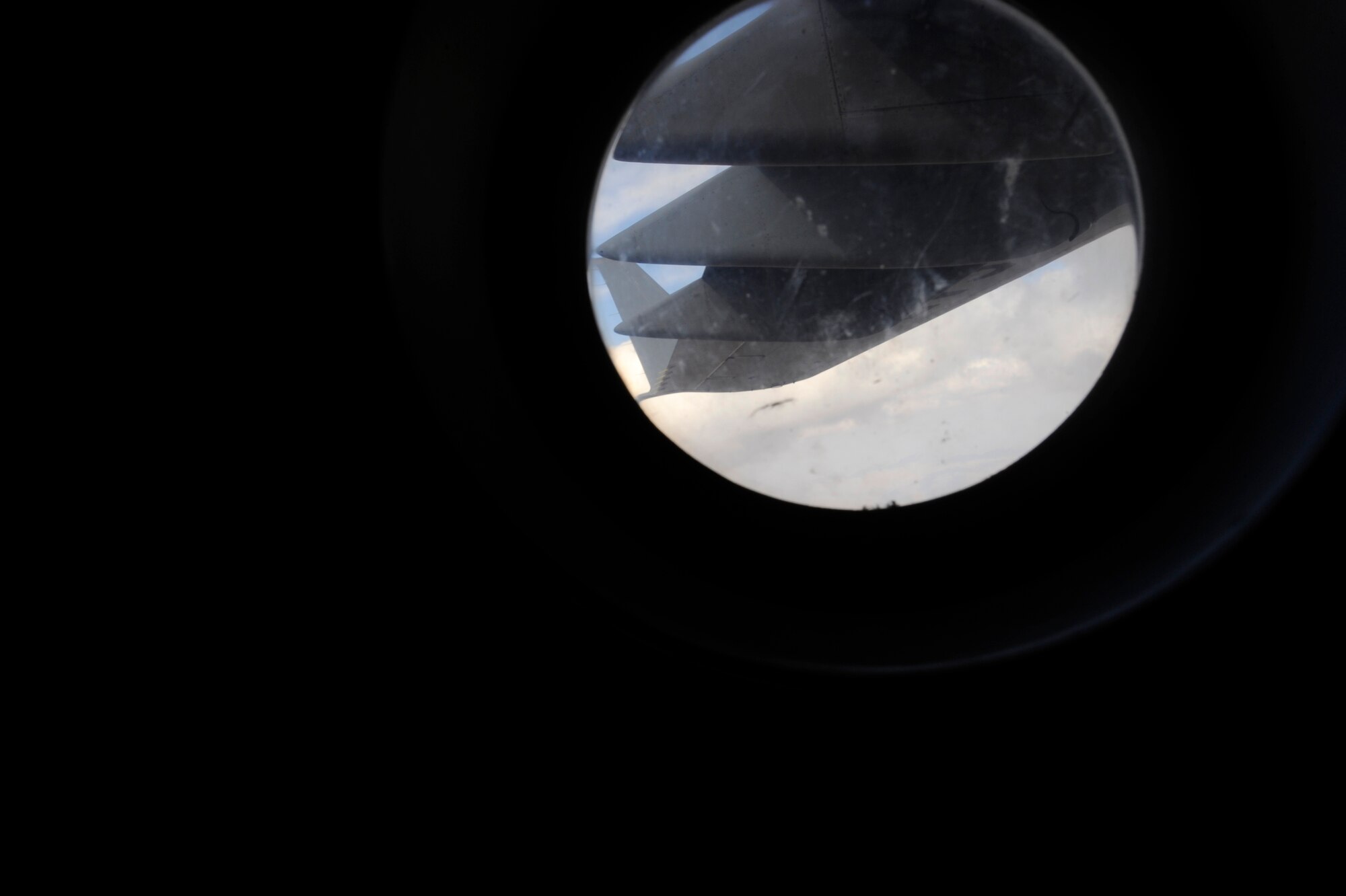 A view from a window of a C-17A Globemaster III in route to pick-up container delivery systems at Kandahar Airfield, May 9, 2010, over Afghanistan. Since the McChord team took over operations on May 2, they have been flying an average of four missions a day; providing global strategic airlift, airdrop, aeromedical evacuation. (U.S. Air Force photo/Staff Sgt. Manuel J. Martinez)