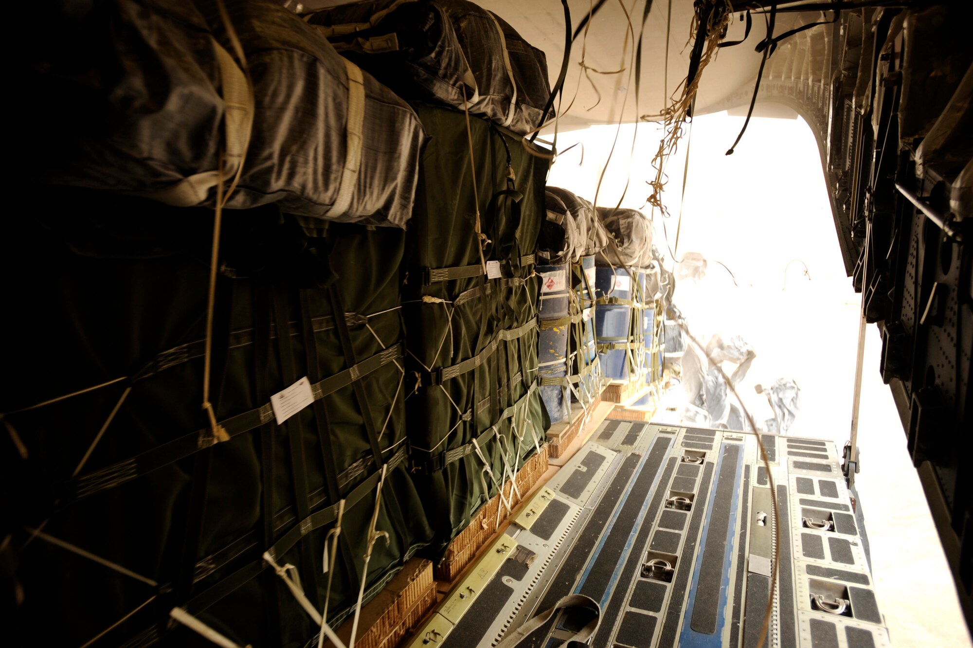 In less than thirty seconds,40 container delivery system bundles totaling 70,000 pounds drop out of a C-17 Globemaster III, May 9, 2010, over a drop zone in Afghanistan. (U.S. Air Force photo/Staff Sgt. Manuel J. Martinez, released)
