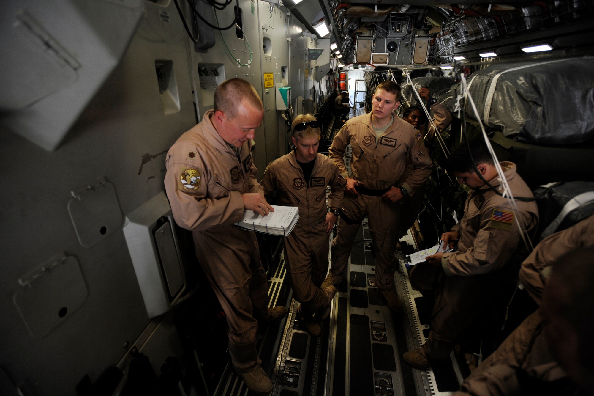 Maj. Mike Parker, a C-17 Globemaster III pilot assigned to the 816th Expeditionary Airlift Squadron, mission-briefs his aircrew prior to take off on an airdrop over Afghanistan, May 9, 2010, at a base in Southwest Asia. (U.S. Air Force photo/Staff Sgt. Manuel J. Martinez, released)