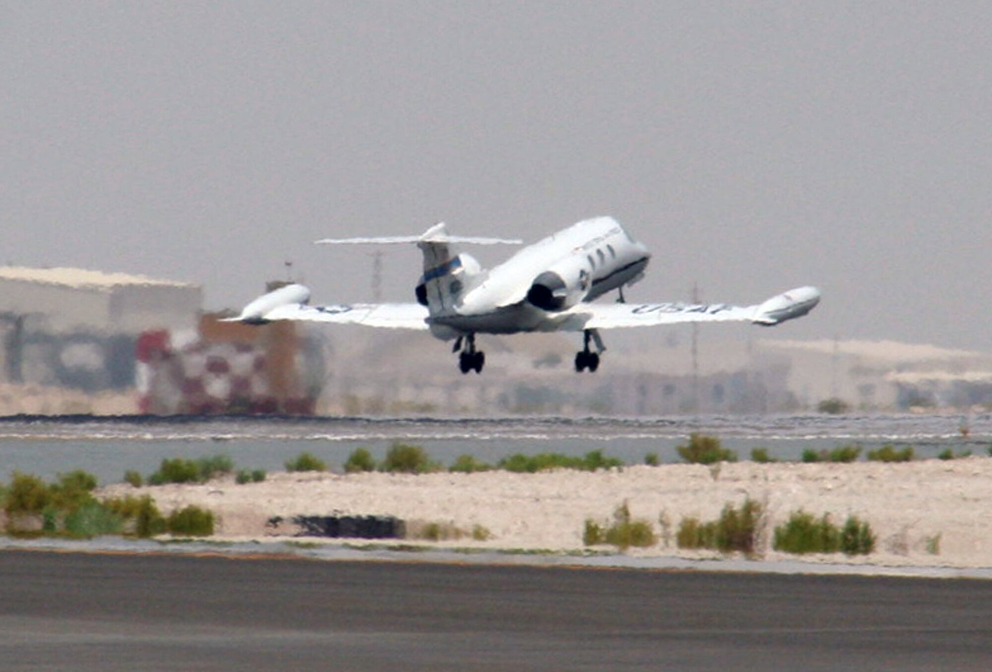 A C-21 passenger jet takes off from the 380th Air Expeditionary Wing area of operations at a non-disclosed location in Southwest Asia on May 19, 2010.  The C-21, according to its Air Force fact sheet, is a twin turbofan engine aircraft used for cargo and passenger airlift. The aircraft is the military version of the Lear Jet 35A business jet. In addition to providing cargo and passenger airlift, the aircraft is capable of transporting one litter or five ambulatory patients during aeromedical evacuations. The C-21 can carry eight passengers and 42 cubic feet (1.26 cubic meters) of cargo. (U.S. Air Force Photo/Master Sgt. Scott T. Sturkol/Released)