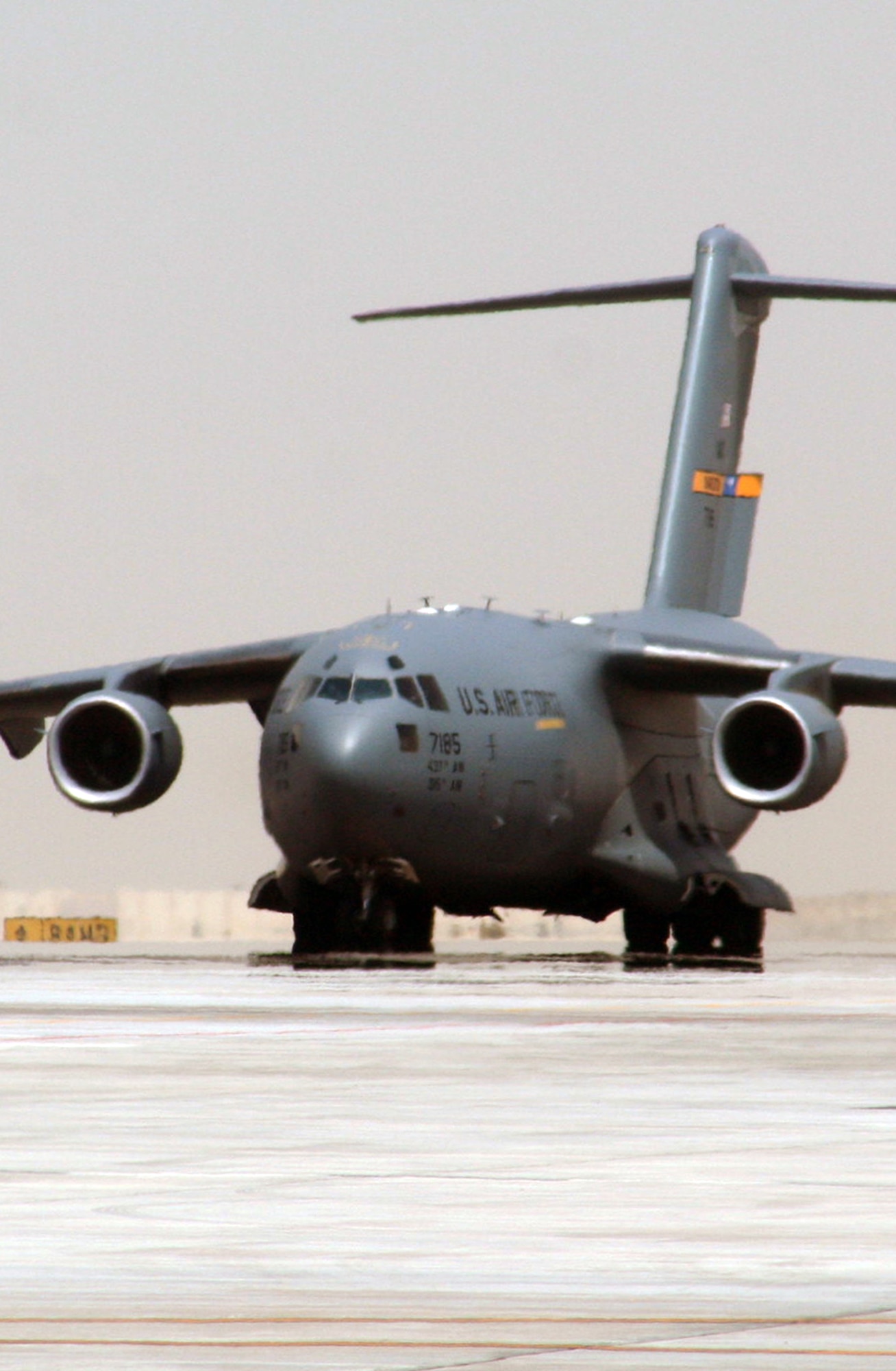 A C-17 Globemaster III deployed from Joint Base Charleston, S.C., taxis down the runway at a non-disclosed base in Southwest Asia after landing May 19, 2010. The C-17 stopped at the base to deliver cargo and passengers for the 380th Air Expeditionary Wing. According to its Air Force fact sheet, the C-17 Globemaster III is the newest, most flexible cargo aircraft to enter the airlift force. The C-17 is capable of rapid strategic delivery of troops and all types of cargo to main operating bases or directly to forward bases in the deployment area. (U.S. Air Force Photo/Master Sgt. Scott T. Sturkol/Released)