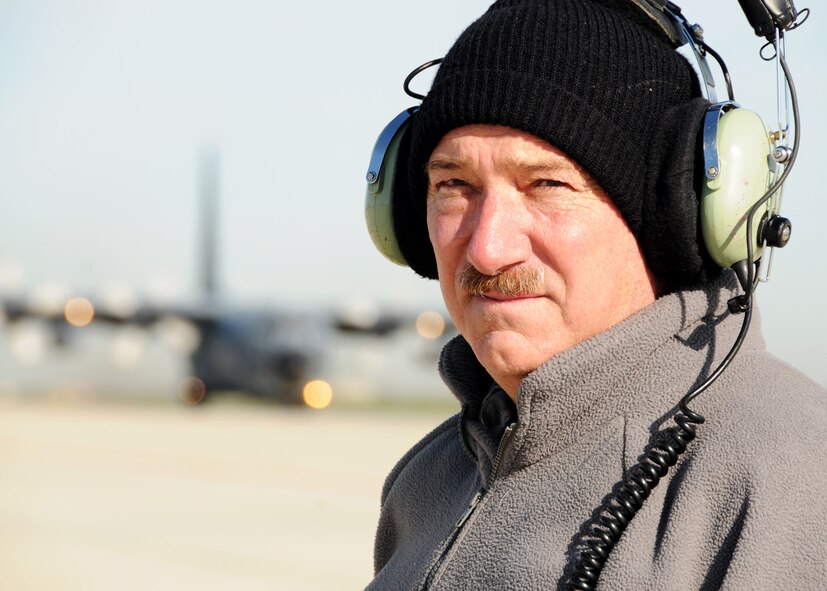 Senior Master Sgt. Bill McAnelly, 919th Maintenance Group, waits on MC-130E Combat Talon #572 to finish taxiing prior to its final departure May 7 at Gowen Field, Idaho.  919th maintainers were sent to Gowen Field to prepare four Talons to take off for one more mission – a flight into retirement and decommissioning.  Three of the Talons flew to Davis-Monthan Air Force Base, Ariz.  The other went to Hurlburt Field, Fla., to be placed in the Air Force Special Operations Command airpark.  (U.S. Air Force photo/Tech. Sgt. Samuel King Jr.)