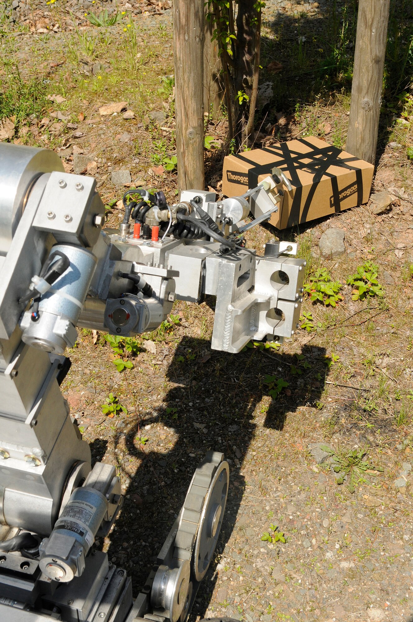U.S. Air Force Airmen operate a Remotec F6A robot to inspect a simulated improvised explosive device during an exercise, Ramstein Air Base, Germany, May 22, 2010. The wing conducts Operational Readiness Exercises to evaluate its mission readiness and the ability to survive and operate in a chemical environment. (U.S. Air Force photo by Airman 1st Class Desiree Esposito)