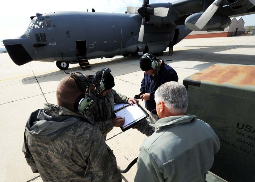 Maintainers with the 919th Special Operations Wing look over the maintenance logbook May 5 at Gowen Field, Idaho.  919th maintainers were sent to Gowen Field to prepare four Talons to take off for one more mission – a flight into retirement and decommissioning.  Three of the Talons flew to Davis-Monthan Air Force Base, Ariz.  The other went to Hurlburt Field, Fla., to be placed in the Air Force Special Operations Command airpark.  (U.S. Air Force photo/Tech. Sgt. Samuel King Jr.)