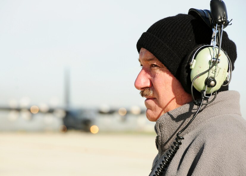 Senior Master Sgt. Bill McAnelly, 919th Maintenance Group, waits on MC-130E Combat Talon #572 to finish taxiing prior to its final departure May 7 at Gowen Field, Idaho.  919th maintainers were sent to Gowen Field to prepare four Talons to take off for one more mission – a flight into retirement and decommissioning.  Three of the Talons flew to Davis-Monthan Air Force Base, Ariz.  The other went to Hurlburt Field, Fla., to be placed in the Air Force Special Operations Command airpark.  (U.S. Air Force photo/Tech. Sgt. Samuel King Jr.)