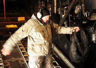 Senior Master Sgt. Bill McAnelly, 919th Maintenance Group, wraps communication cable inside of a MC-130E Combat Talon.  919th maintainers were sent to Gowen Field, Idaho, to prepare four Talons to take off for one more mission – a flight into retirement and decommissioning.  Three of the Talons flew to Davis-Monthan Air Force Base, Ariz.  The other went to Hurlburt Field, Fla., to be placed in the Air Force Special Operations Command airpark.  (U.S. Air Force photo/Tech. Sgt. Samuel King Jr.)
