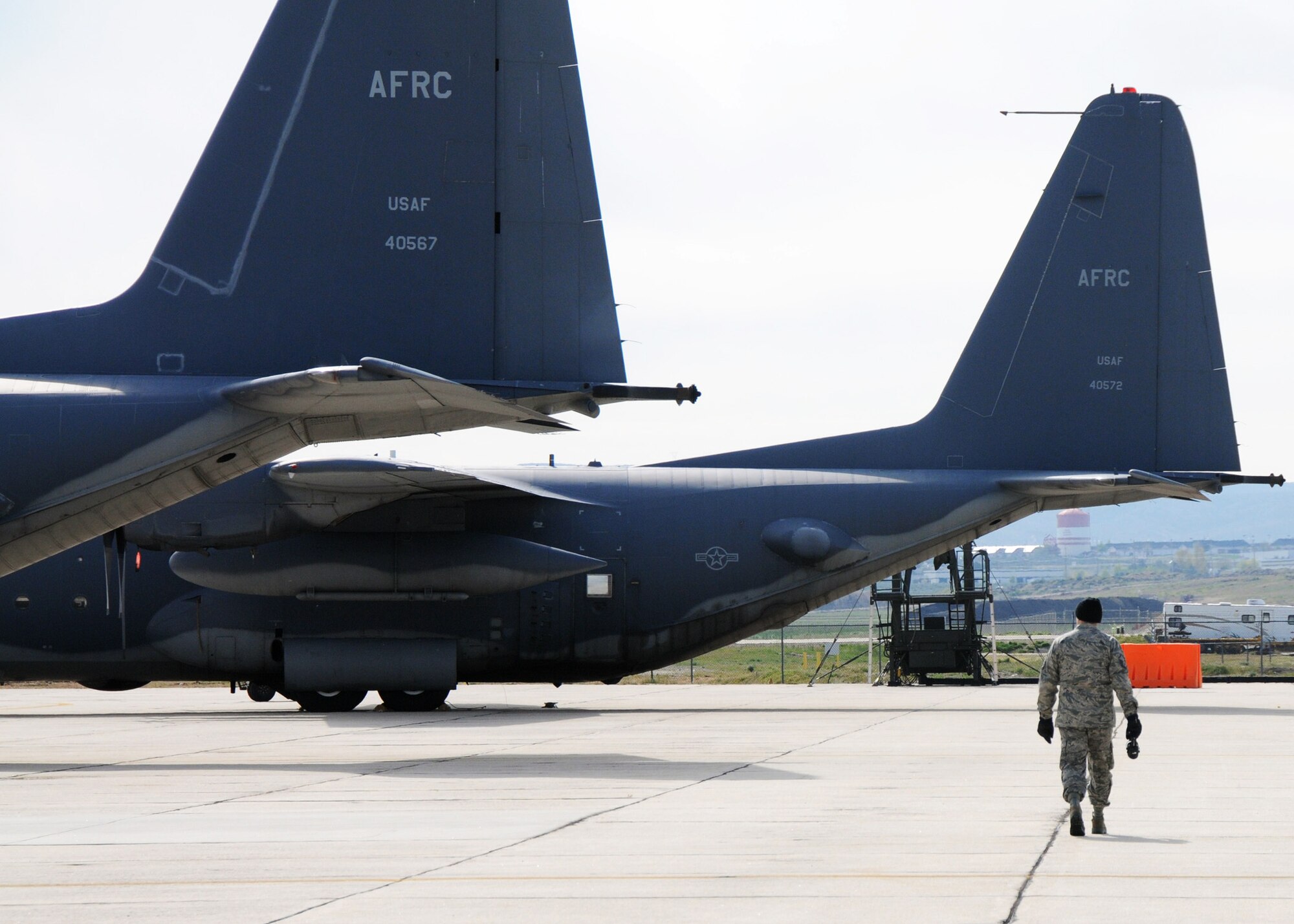 Master Sgt. Larry Pelton, 919th Maintenance Group, walks toward the last two remaining MC-130E Combat Talons destined for retirement.    919th maintainers were sent to Gowen Field, Idaho, to prepare four Talons to take off for one more mission – a flight into retirement and decommissioning.  Three of the Talons flew to Davis-Monthan Air Force Base, Ariz.  The other went to Hurlburt Field, Fla., to be placed in the Air Force Special Operations Command airpark.  (U.S. Air Force photo/Tech. Sgt. Samuel King Jr.)